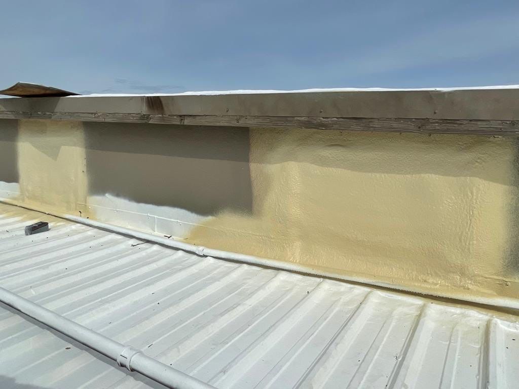 Metal roof restoration on commercial roof using Conklin Benchmark/ PUMA XL acrylic coatings over metal and foam by Straight Edge Roofing Inc