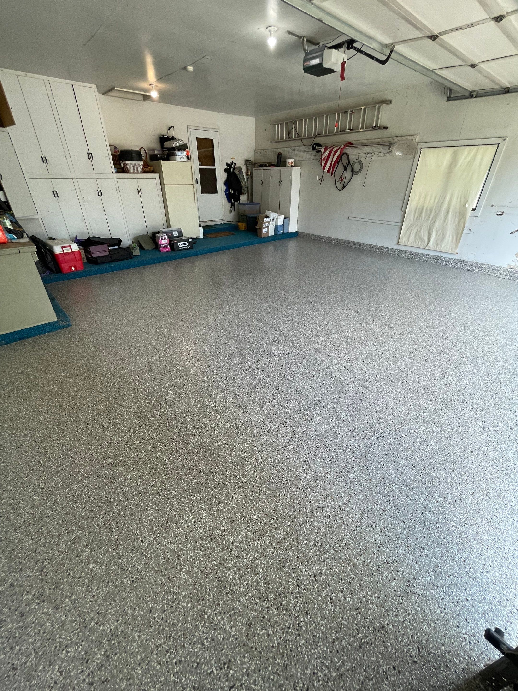 Custom Creekbed Garage Floor Coating in Sioux Falls by Select Painting, Coatings & Garage Cabinets