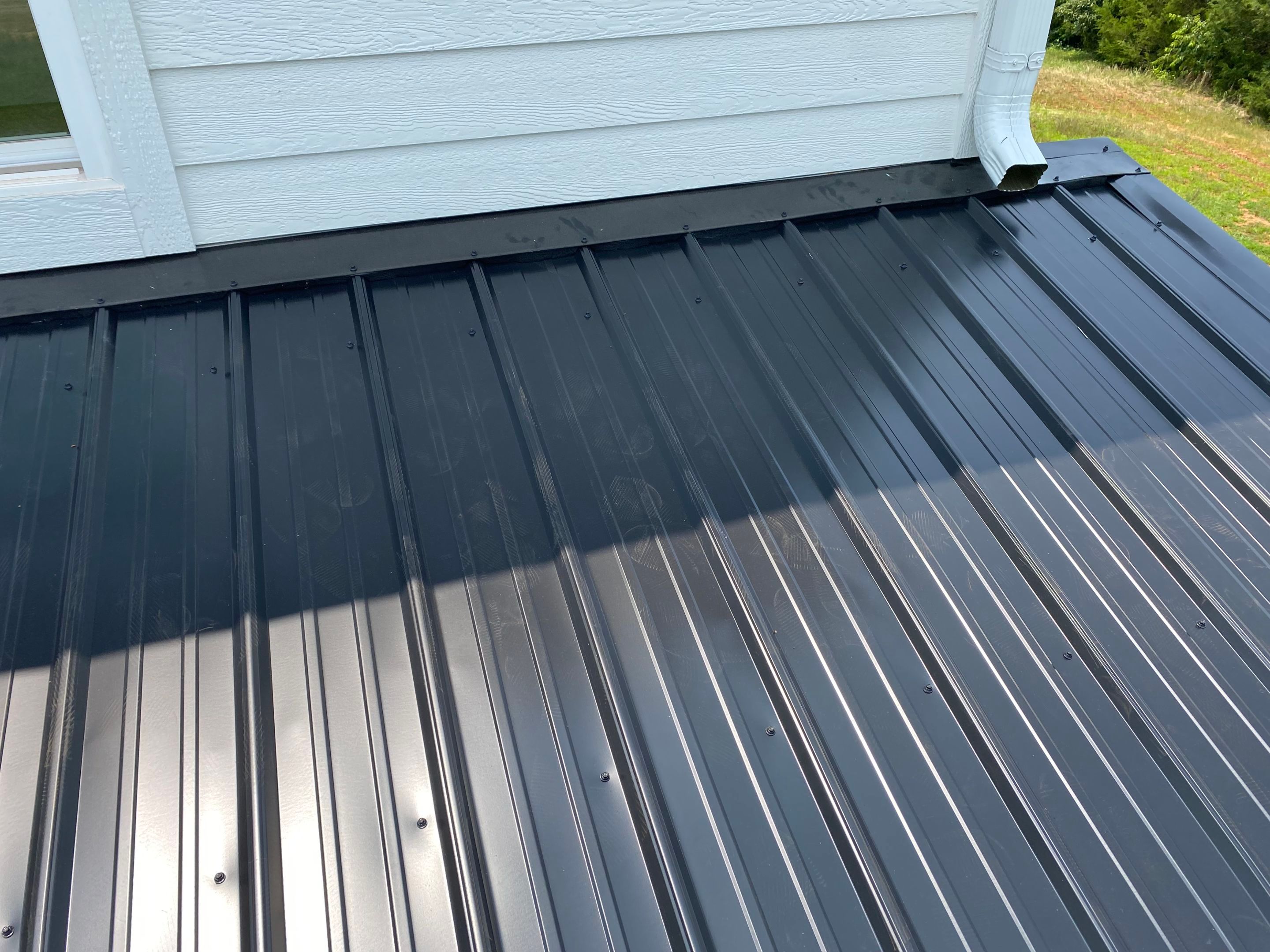 Jason's metal porch roof by BROCK BUILDERS 