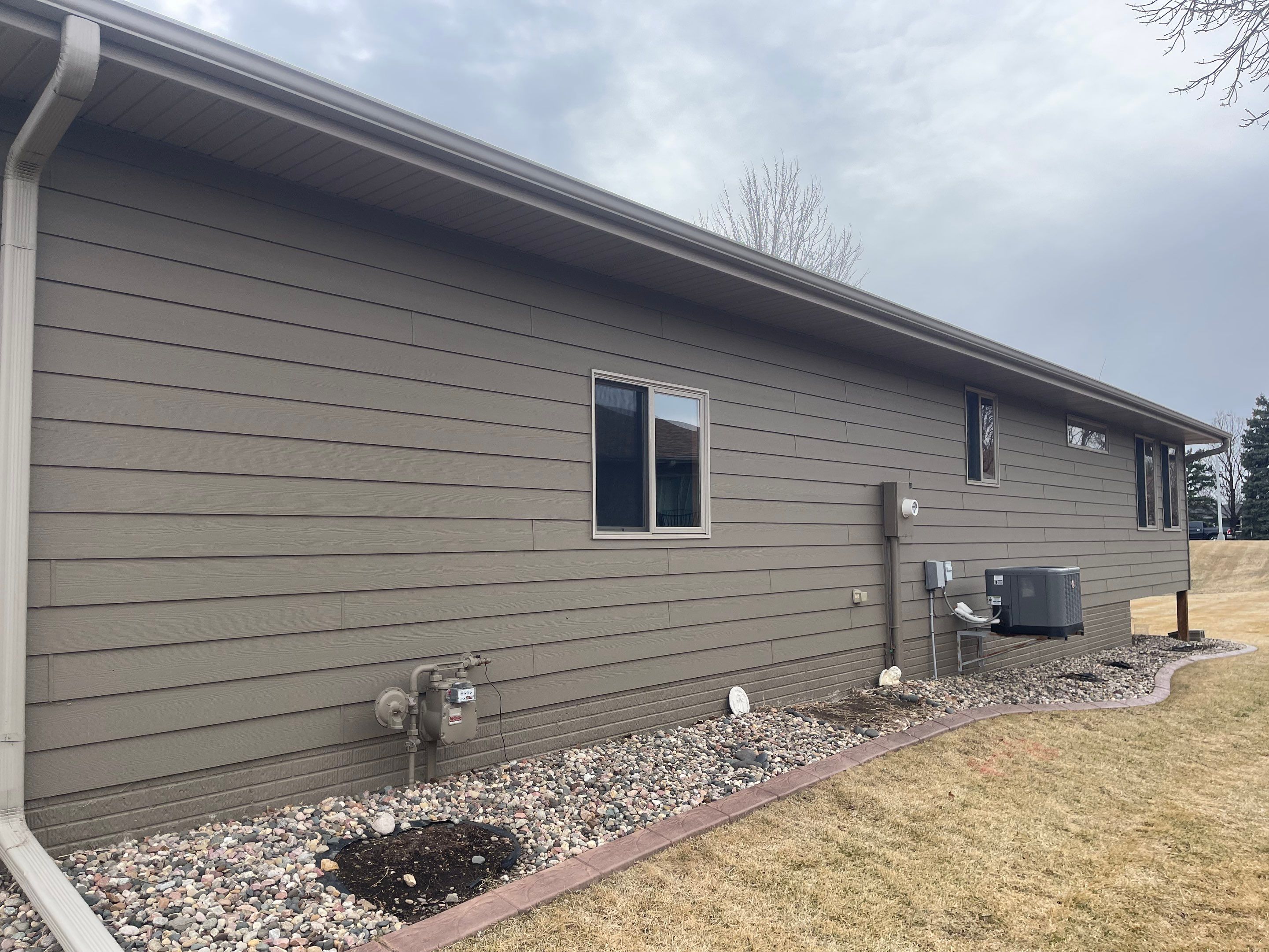 Residential Exterior Siding and Trim Painting in Sioux Falls by Select Painting, Coatings & Garage Cabinets