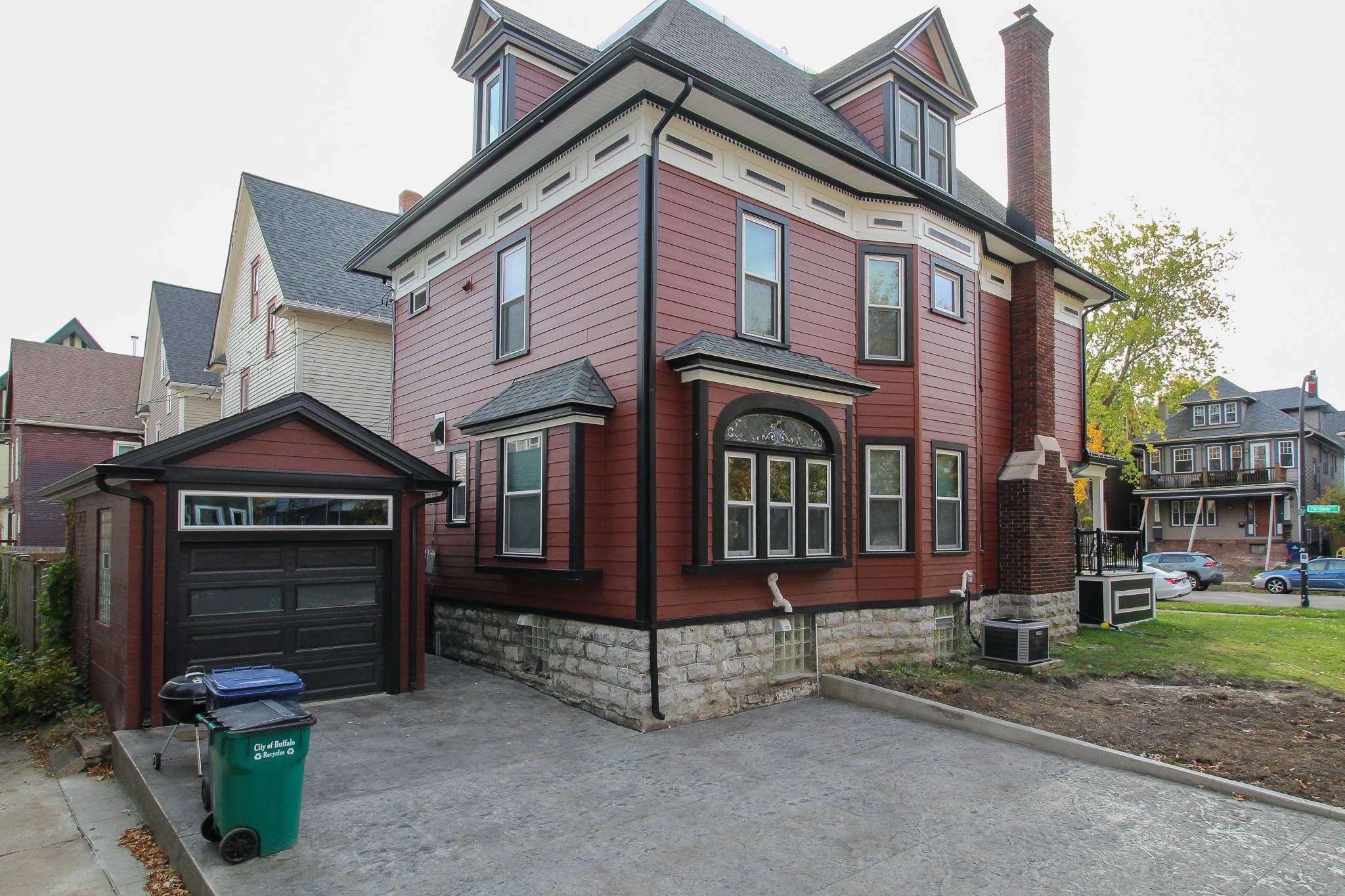 Exterior Renovations- Siding, Stamped Concrete, Porch, and Railings by Ivy Lea Construction