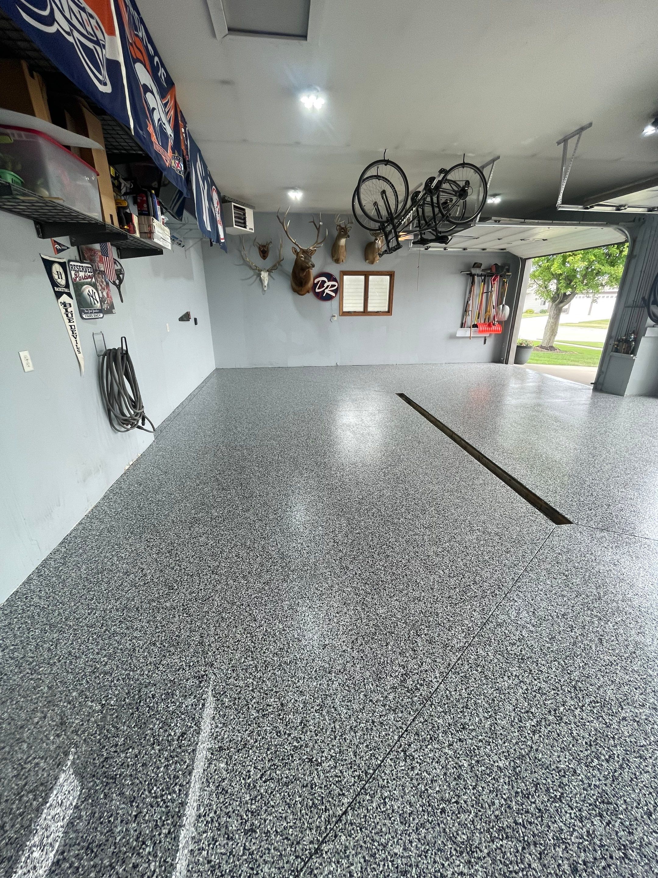 Full Garage Floor Epoxy Coating Installation in Dell Rapids by Select Painting, Coatings & Garage Cabinets
