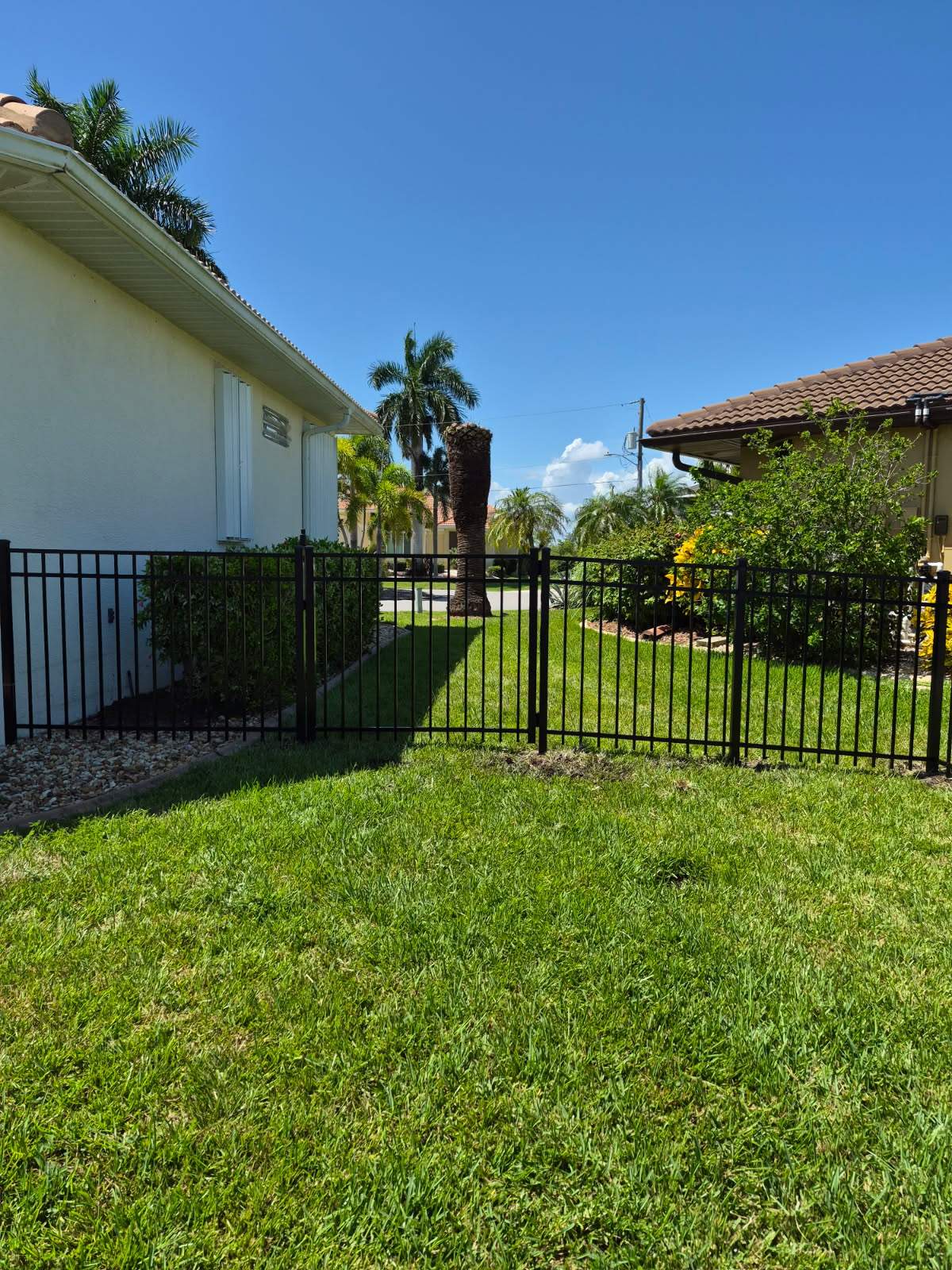 Custom Black Aluminum Fence Enclosure for Punta Gorda Waterfront Property by True Fence LLC