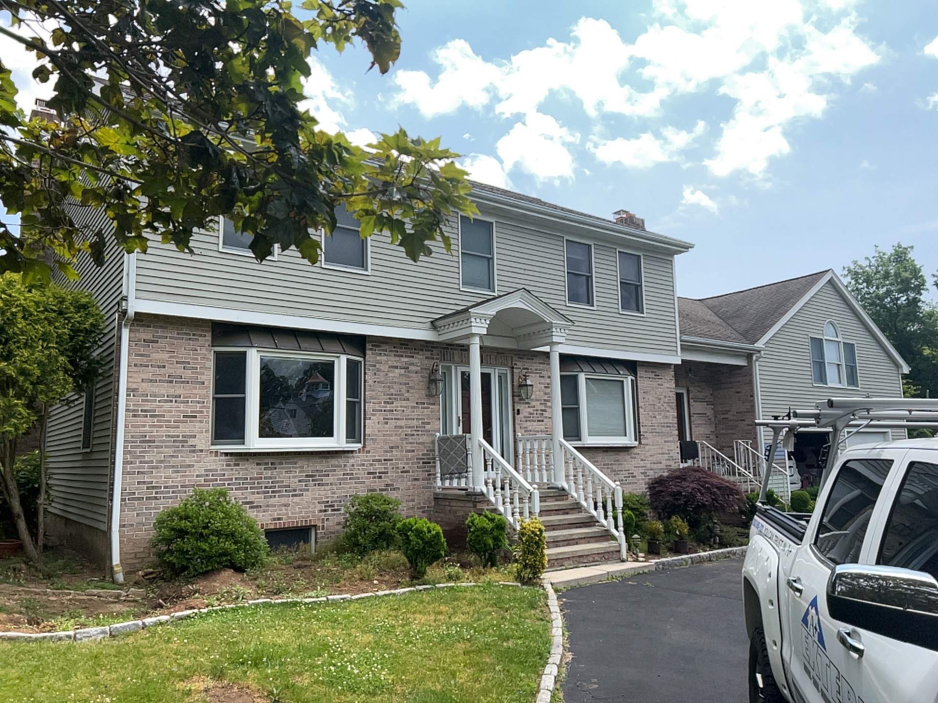 Siding Installation using Mainstreet Colonial & White gutters by A Plus Exterior
