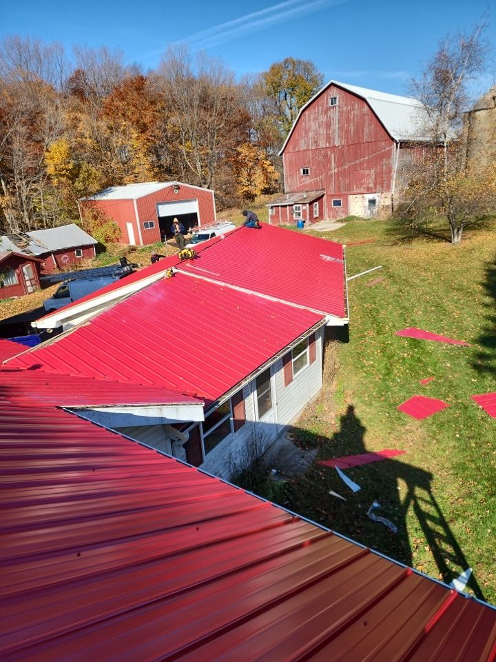 Residential Roof Installation with Red Pro Rib Metal Roofing in Adell, WI by Gellings Roofing & Siding
