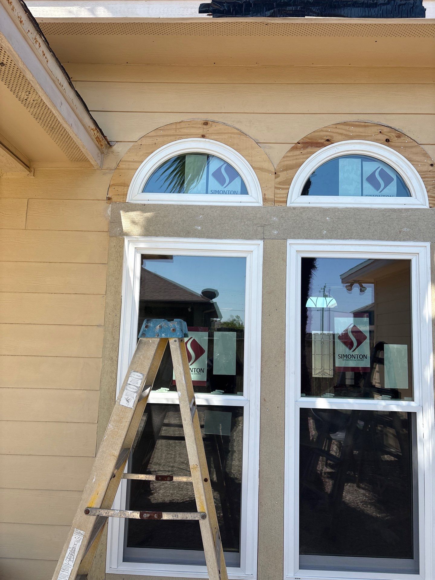 Curved Trim Windows by Bayfront Roofing and Construction