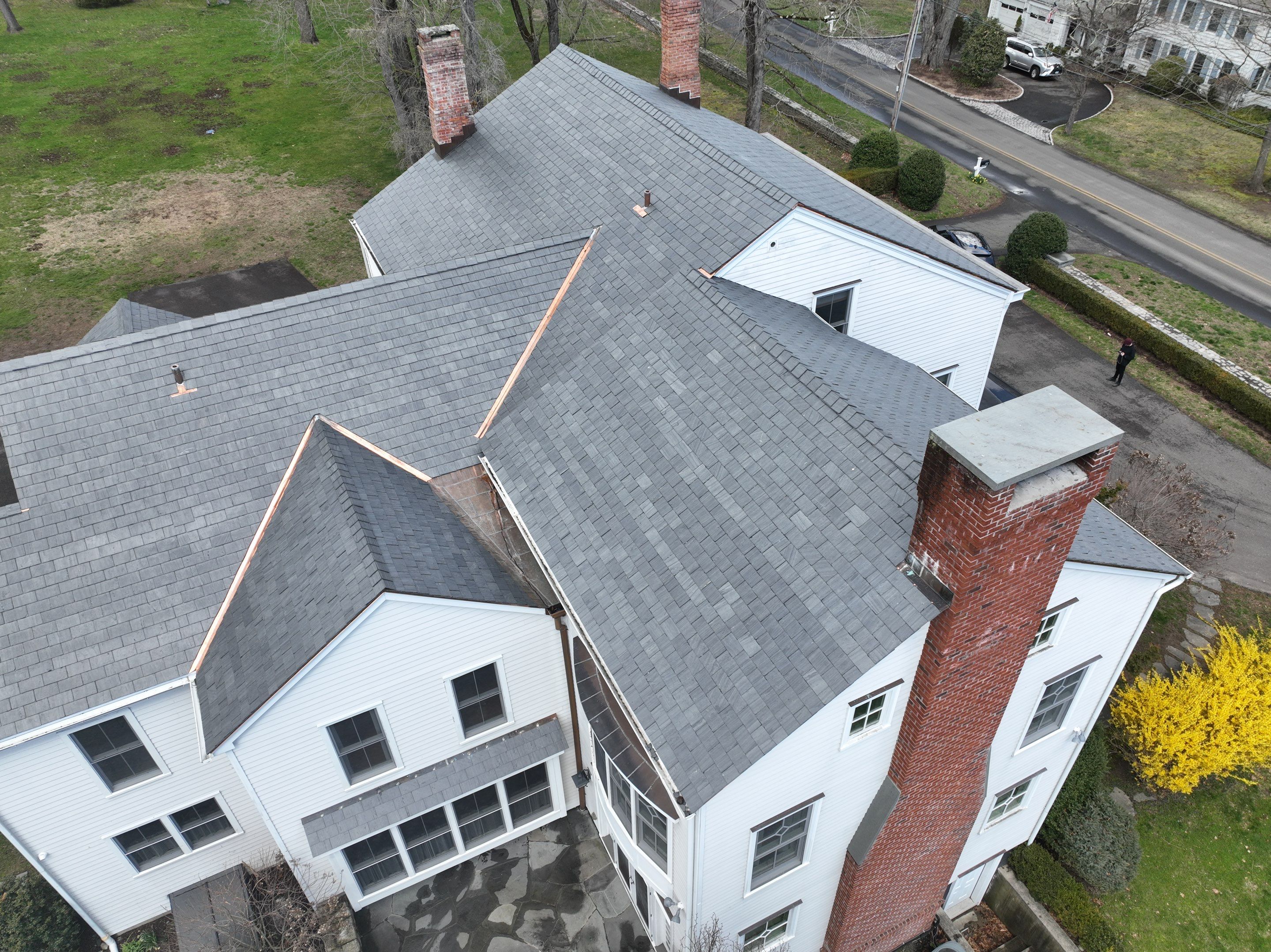 Residential Roofing Installation using Vermont Slate by A Plus Exterior
