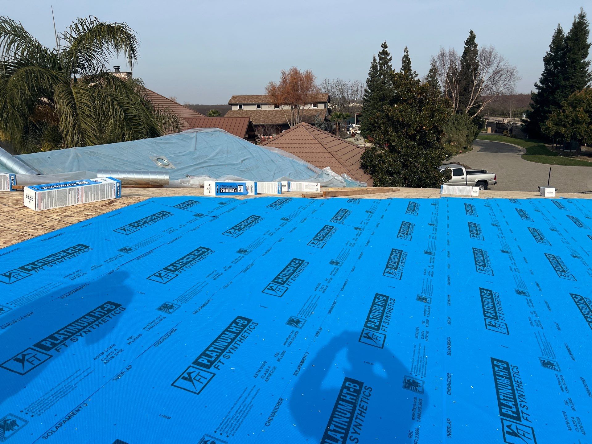 Tile, Metal, and TPO roofing project (new construction) by Straight Edge Roofing Inc