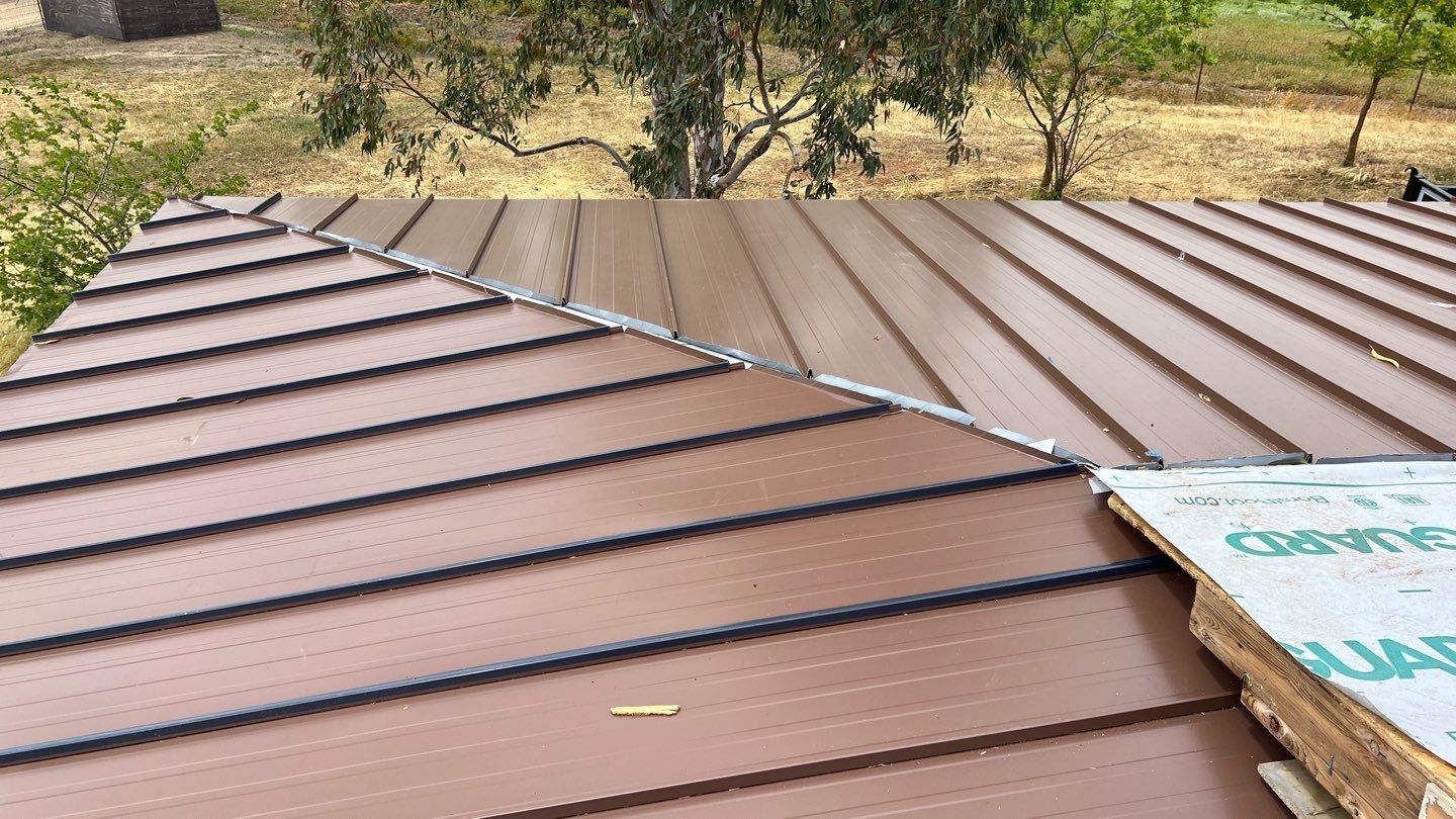 Metal roofing installation using Standing seam metal roofing system by Straight Edge Roofing Inc