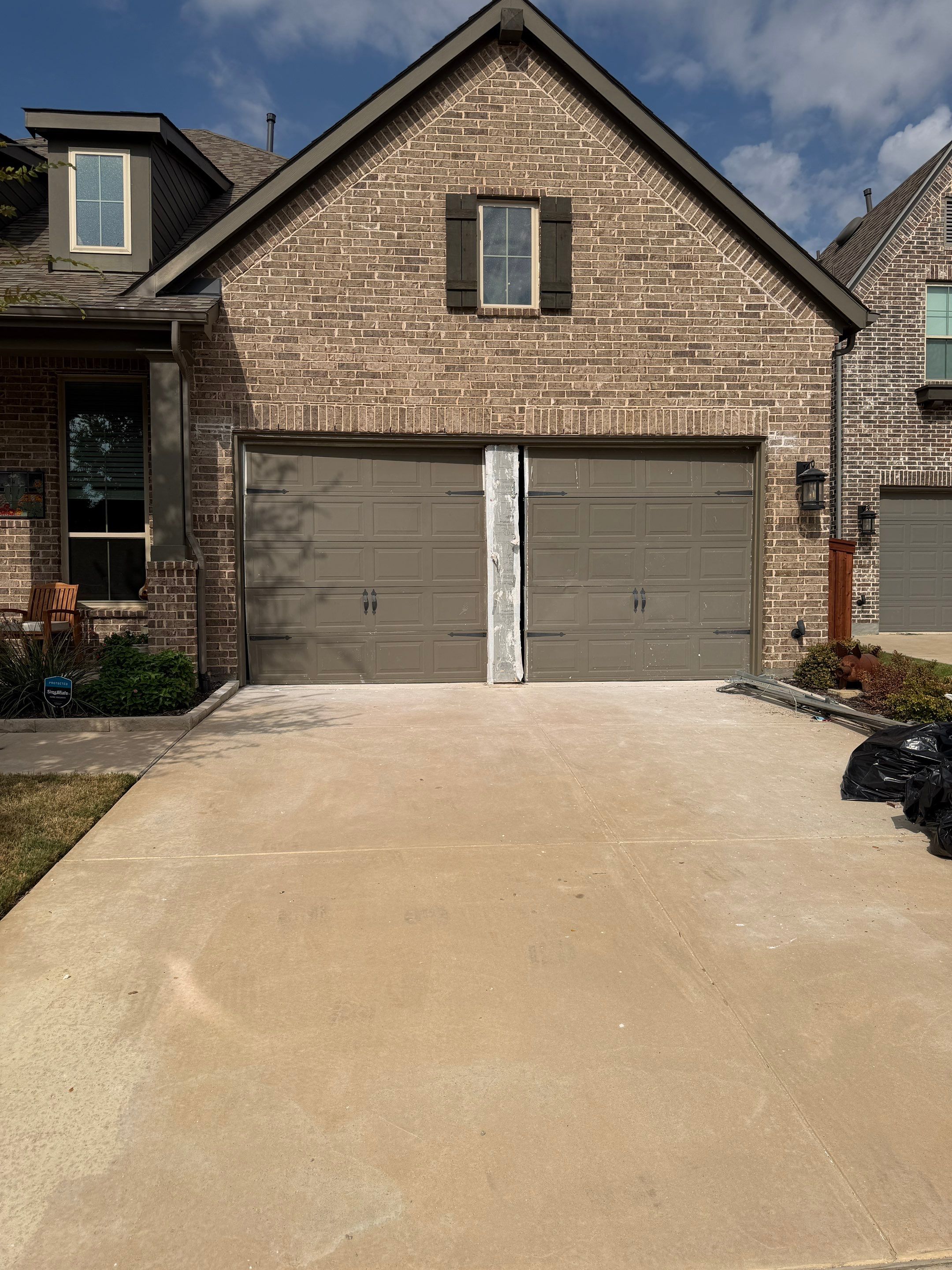 Garage Door Center Post Conversion in Aubrey, Texas by Meadows Garage Doors