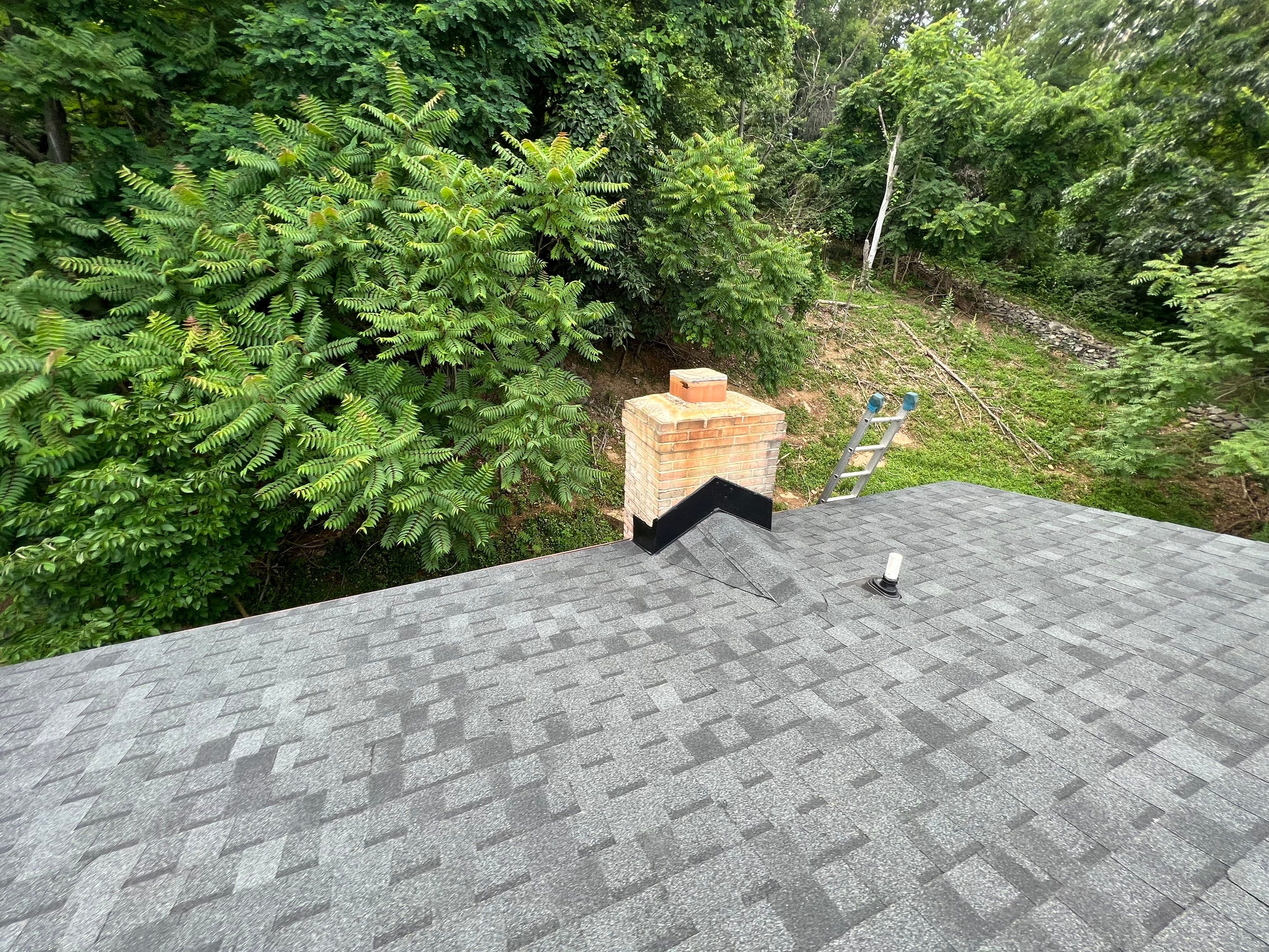 Residential Roofing Installation using Atlas Pinnacle Pristine Black Architectural Shingles by Frederick Roof Repair
