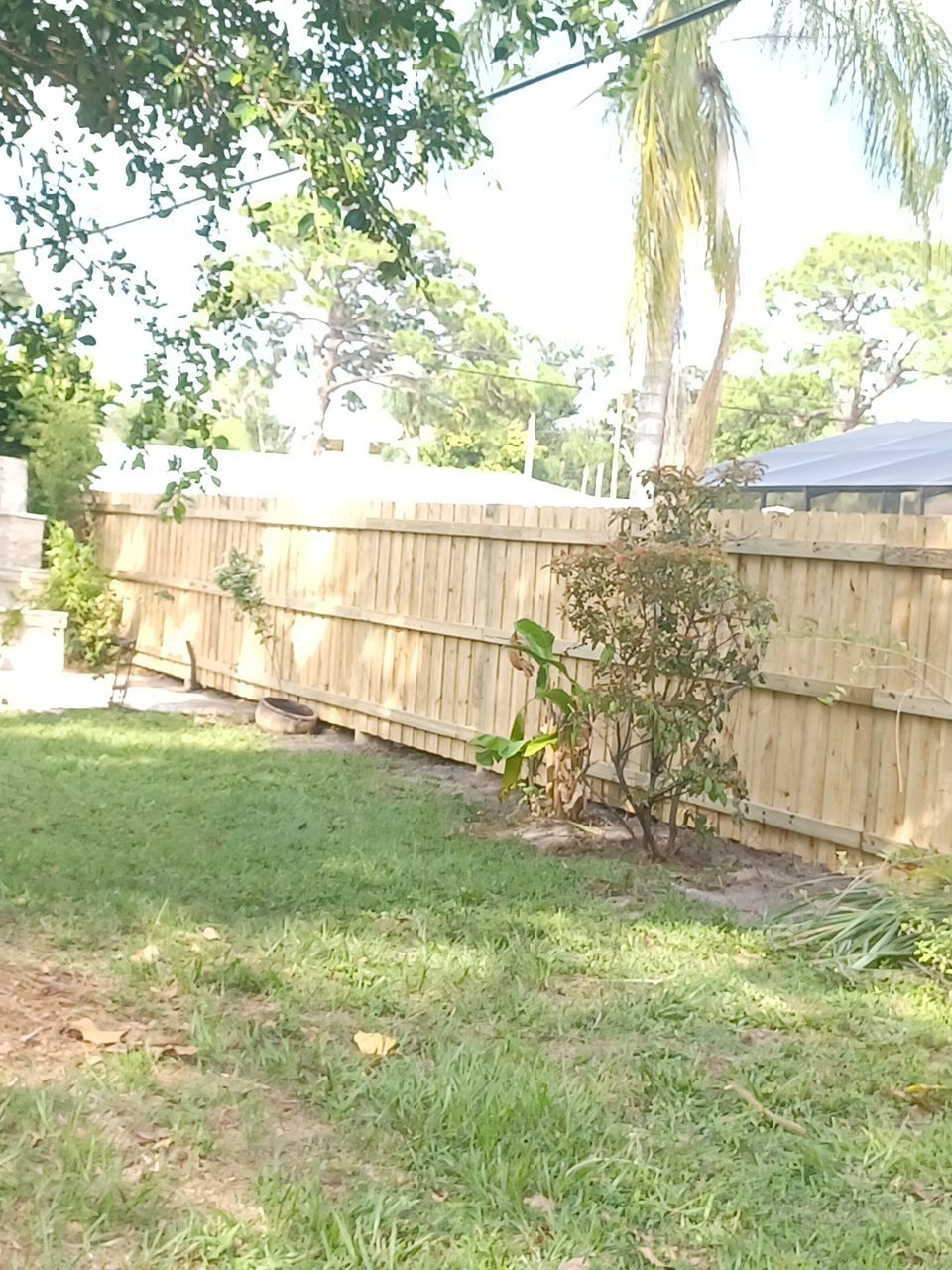Sarasota, FL 6ft. Tall Treated Board on Board Wood Fence by Asap fence and gates, LLC