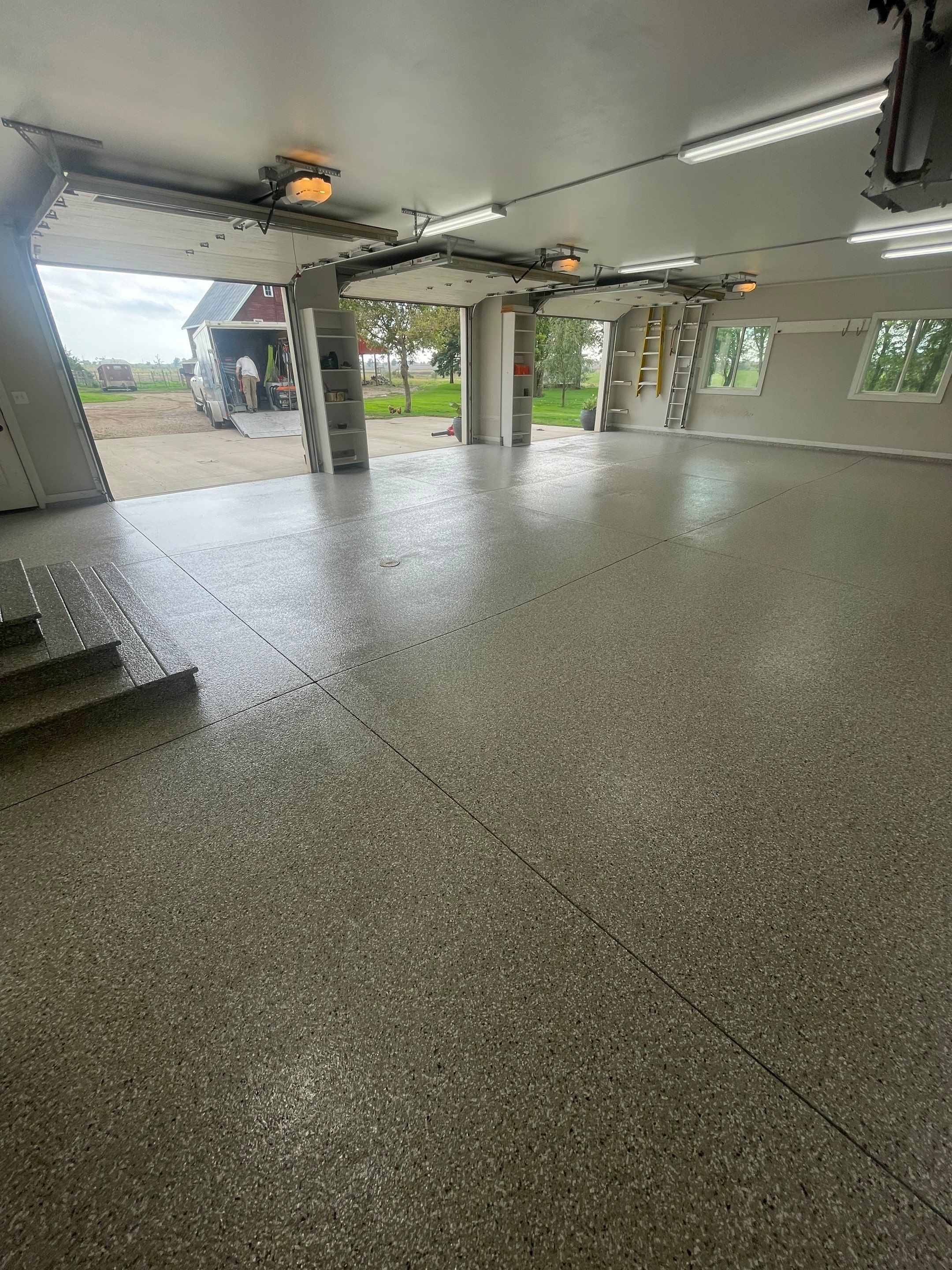 Grey Speckled Polyuera Garage Floor Coating for Hartford Three-Car Garage by Select Painting, Coatings & Garage Cabinets