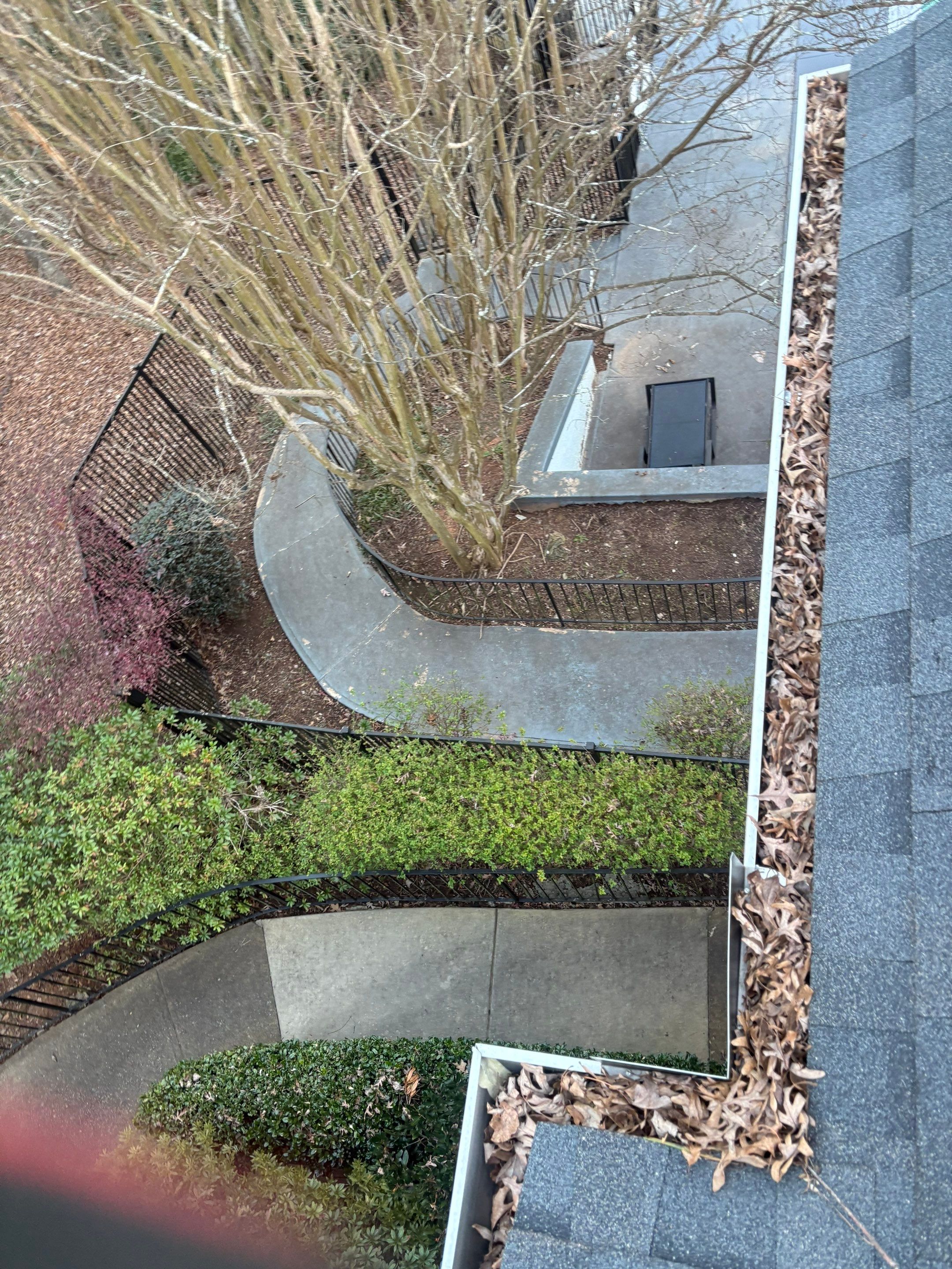 Commercial gutter cleaning Georgia before photo with filled gutters