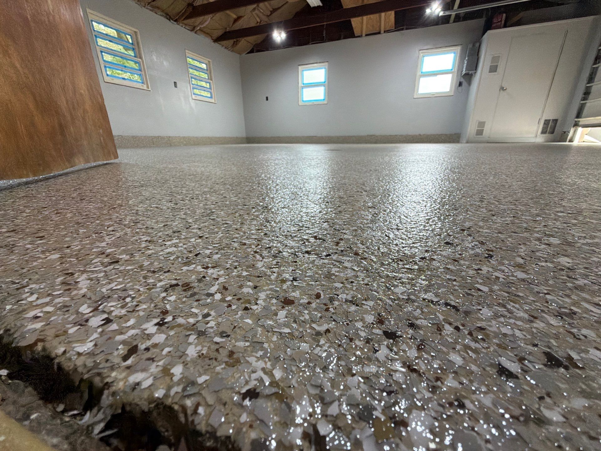 Garage Epoxy Flake Floor Installation and Exterior Siding Repairs in Muskegon by Gordon Painting