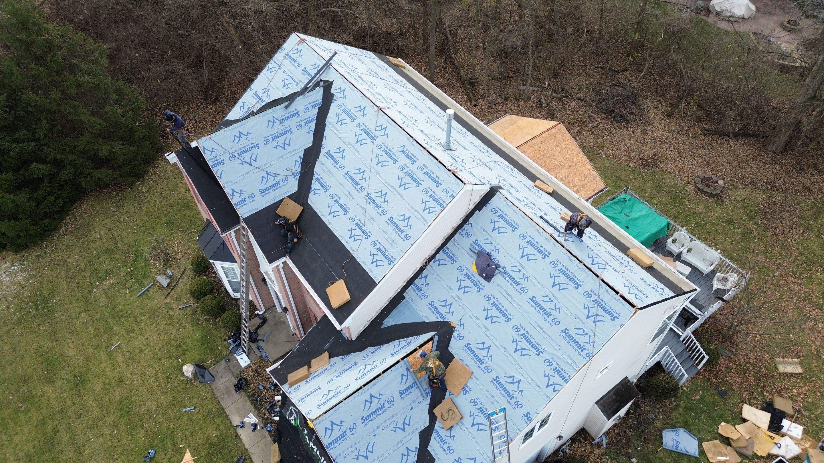 Walden Ponds - Pristine Black and Hydro Flo Gutter Guards by Tamlin Roofing