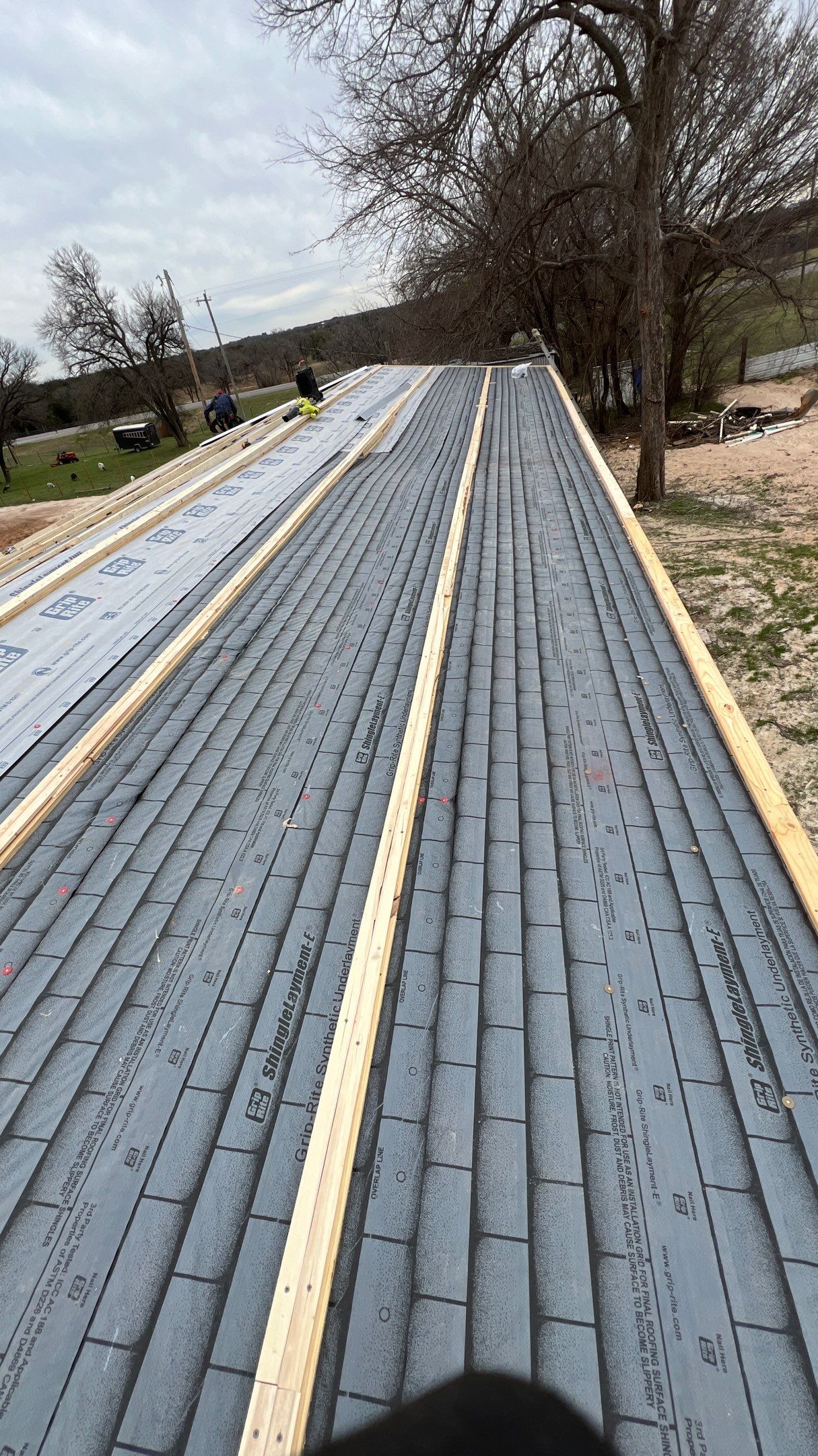 Residential Roofing Installation using PBR Metal Roof by Harvey Roofing & Construction