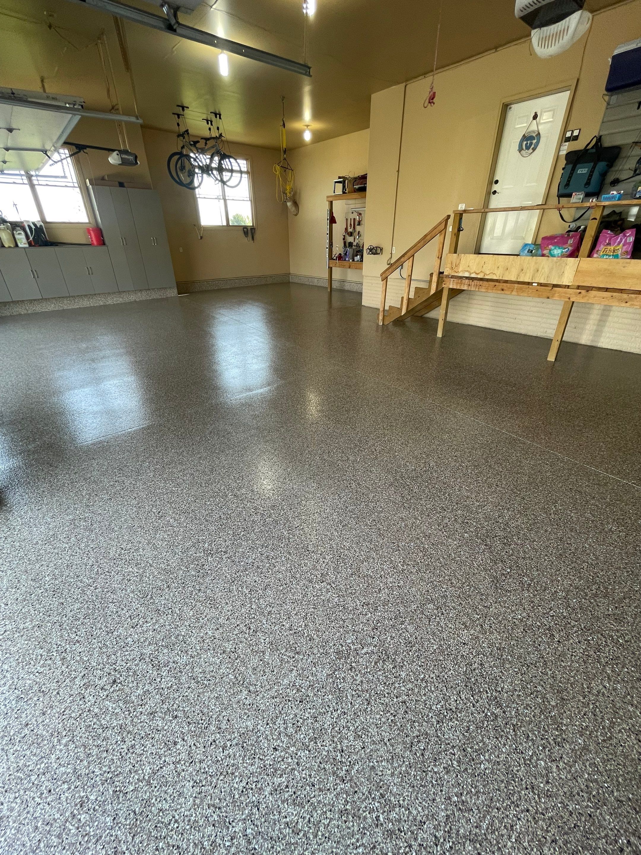 Residential Garage Floor Transformation with Speckled Epoxy Coating by Select Painting, Coatings & Garage Cabinets