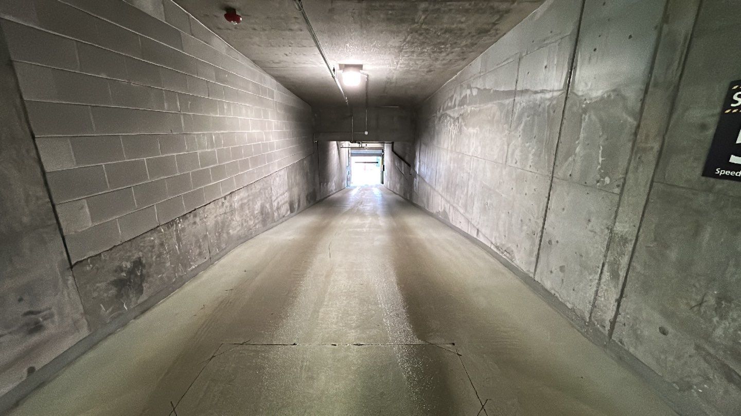 Parking garage using Hot water by Northern Power Washing LLC.