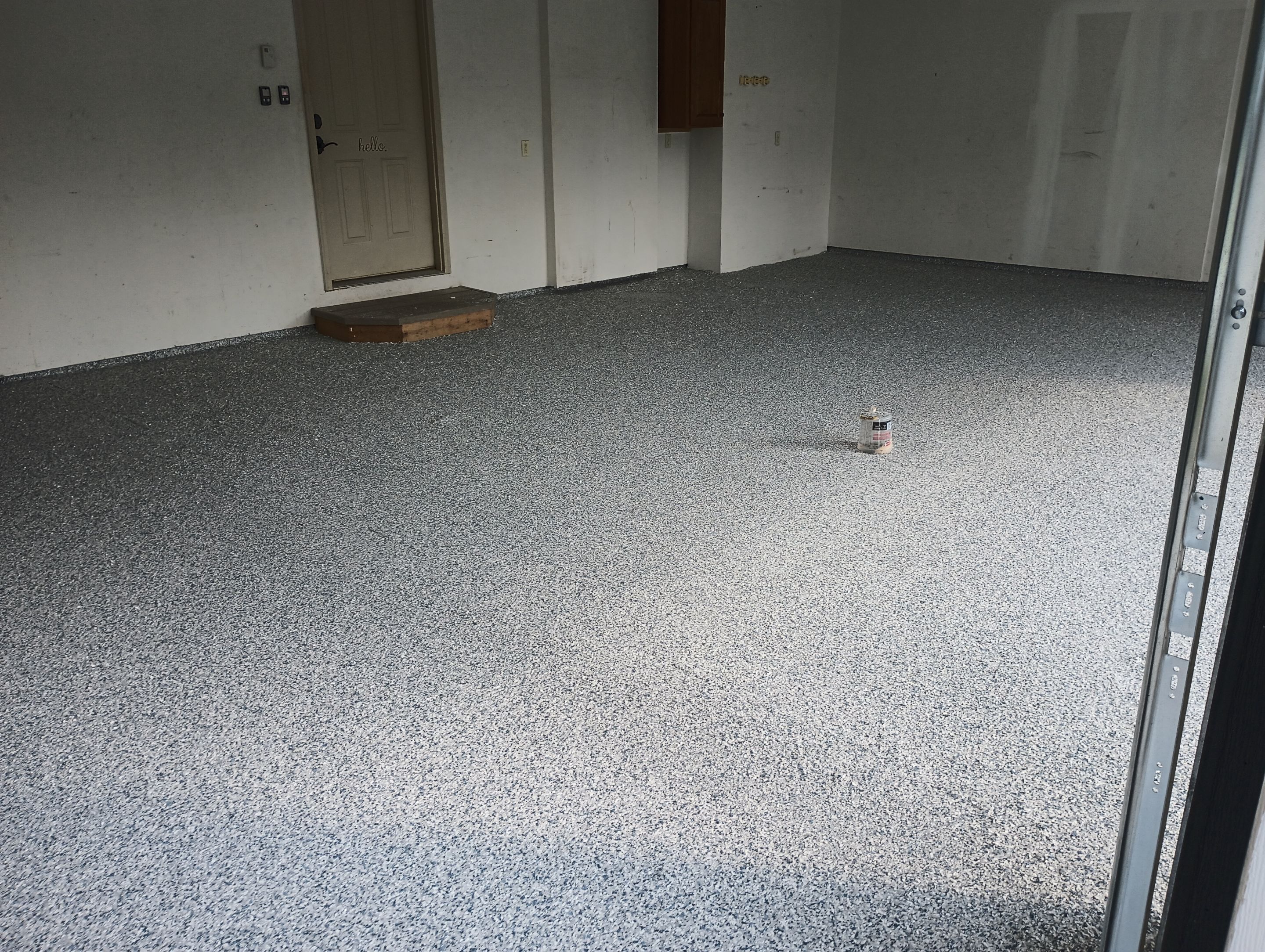 Garage Concrete Coating Installation in Sioux Falls Using Tidal Wave Finish by Select Painting, Coatings & Garage Cabinets