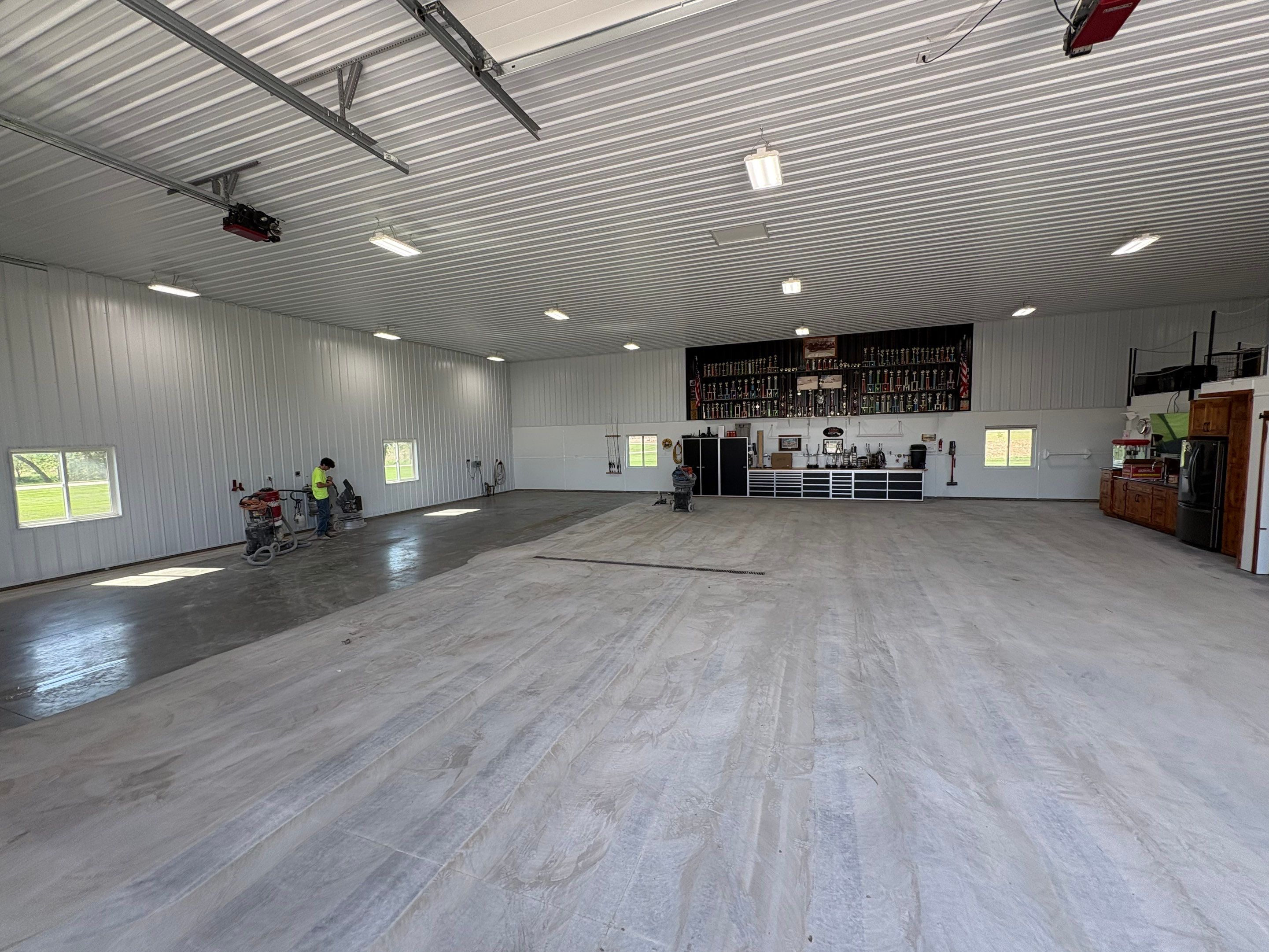 Multi-Stage Concrete Floor Coating for Egan Shop and RV Storage by Select Painting, Coatings & Garage Cabinets