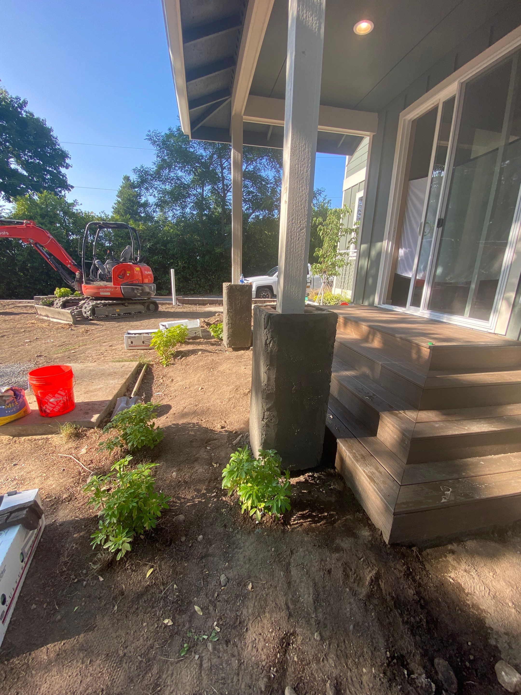 Patio Installation using Concrete, Retaining walls, and Turf install by Jireh Asphalt & Concrete Inc 