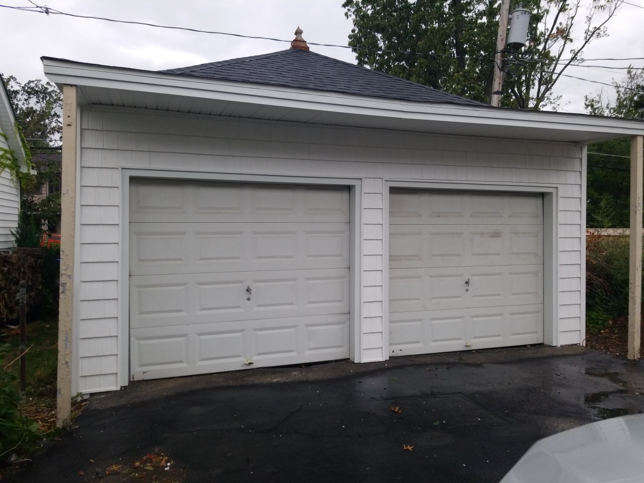 Residential Roofing Installation, Dec-tek walk-out porch roof, siding on garage by Absolute Roofing and Construction