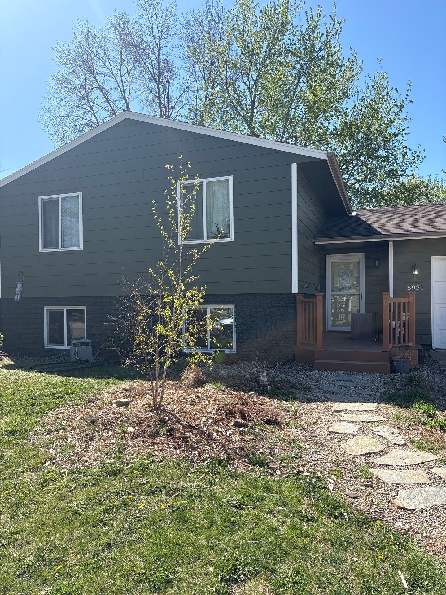 Full Exterior House Painting and Foundation Refinishing in Sioux Falls by Select Painting, Coatings & Garage Cabinets