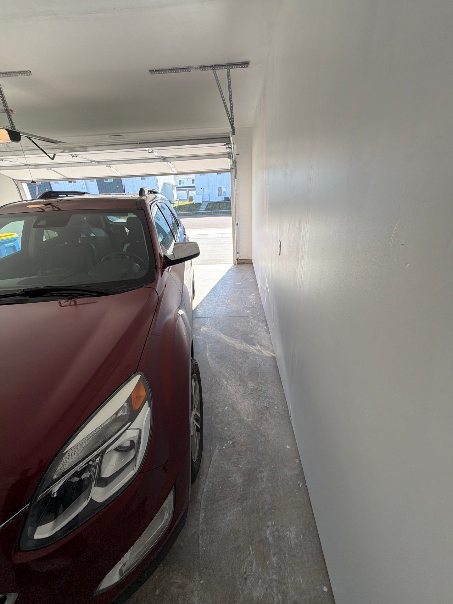 Sioux Falls Garage Floor Transformation with Cabin Fever Decorative Chips by Select Painting, Coatings & Garage Cabinets