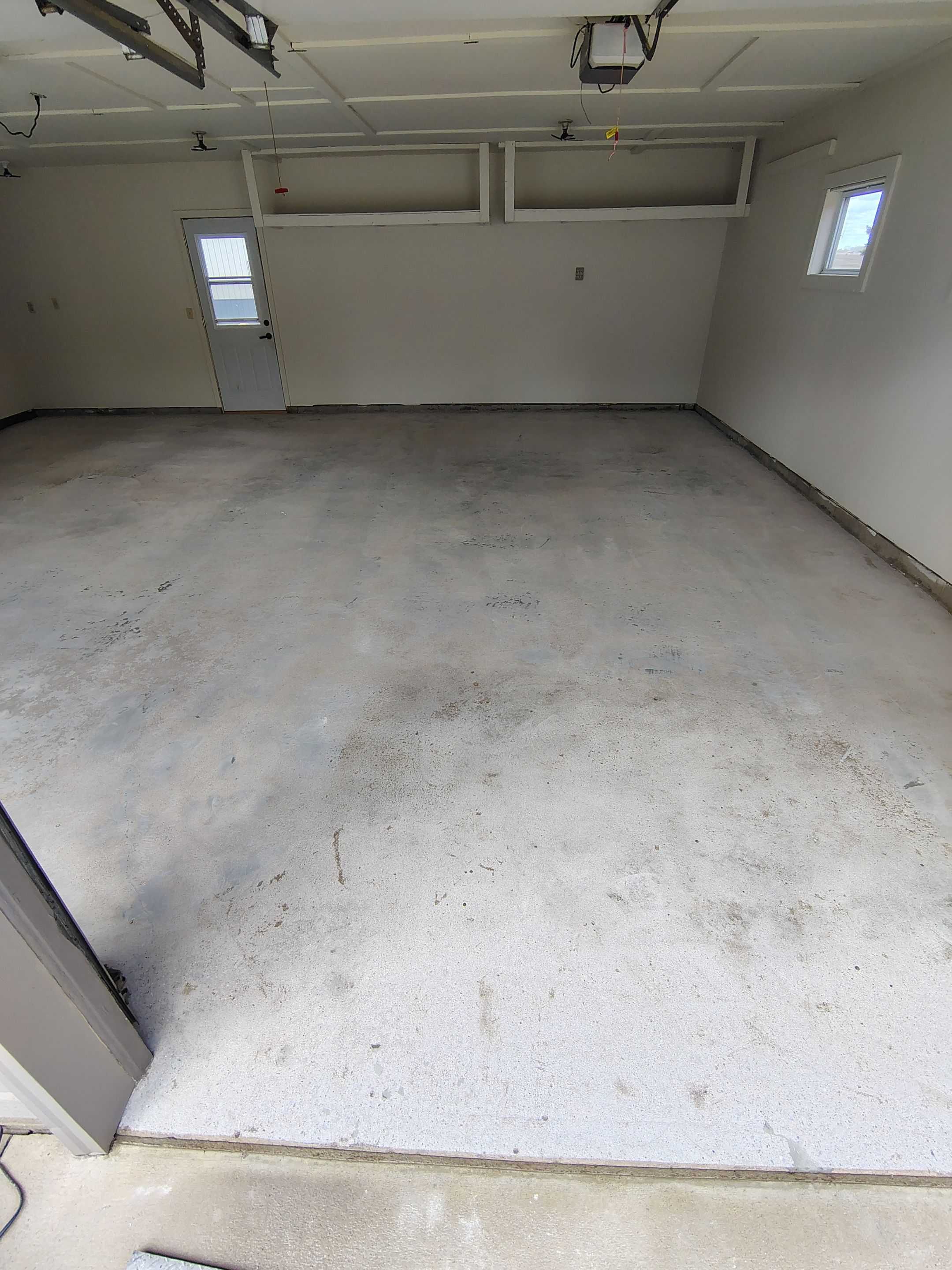 Full-Flake Epoxy Garage Floor Coating Installation in Sioux Falls by Select Painting, Coatings & Garage Cabinets