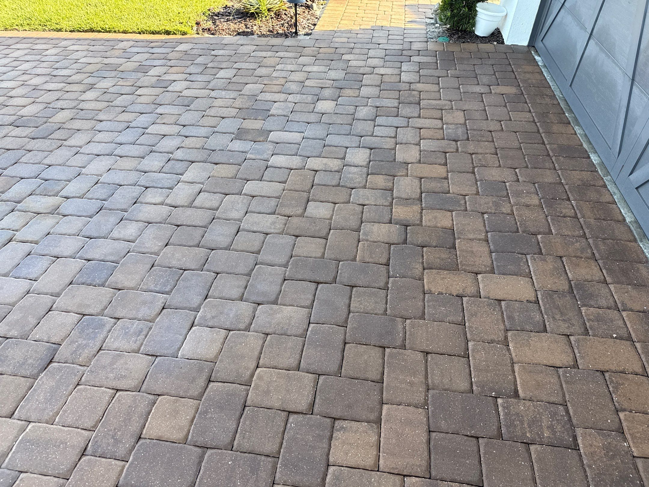 Oil Stain Removal on Paver Driveway | Esplanade at Artisan Lakes, Palmetto FL by Sunshine AquaWash