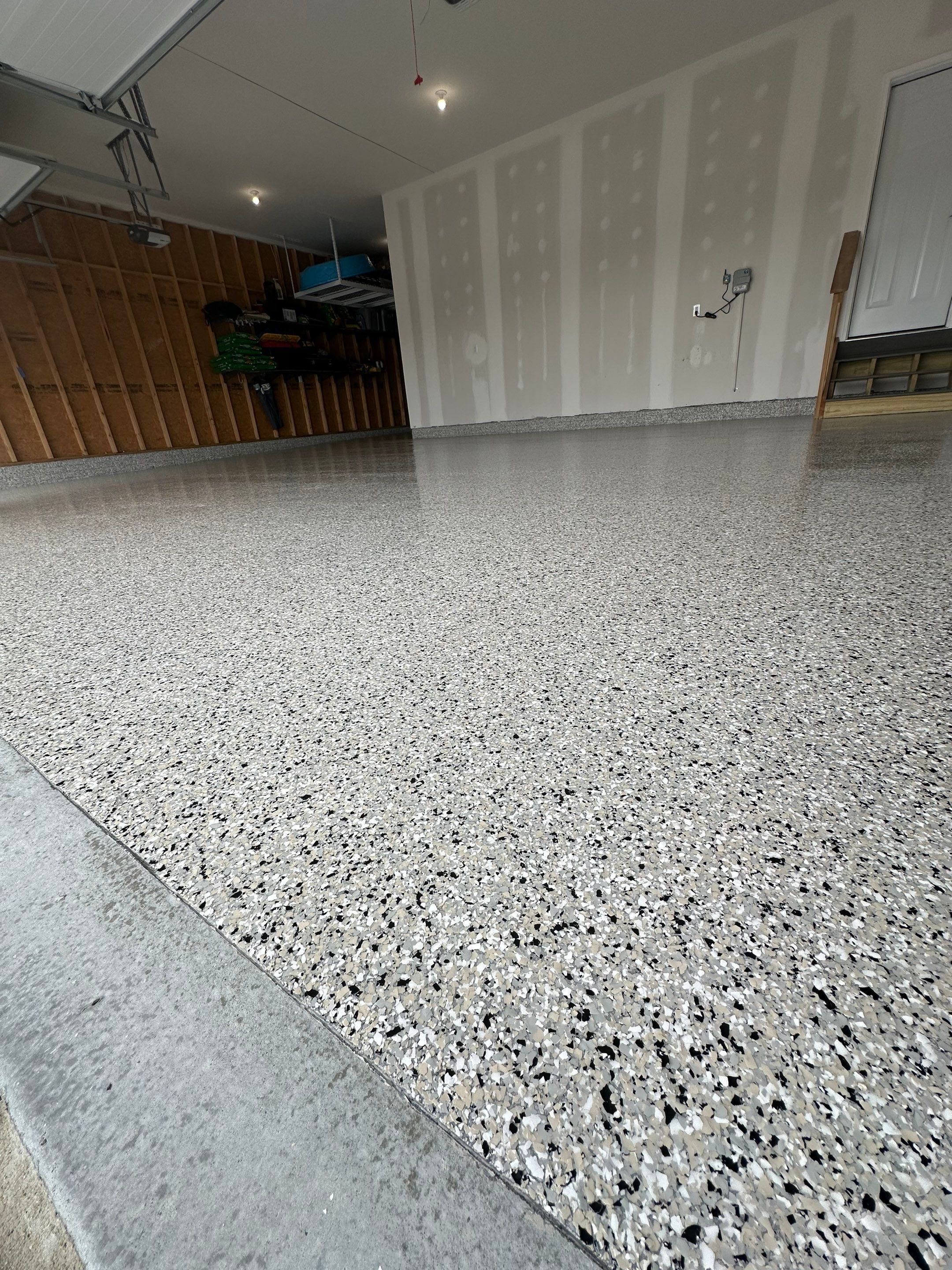 Three-Stall Garage Epoxy Floor Coating Installation in Lincoln by Goat Coatings