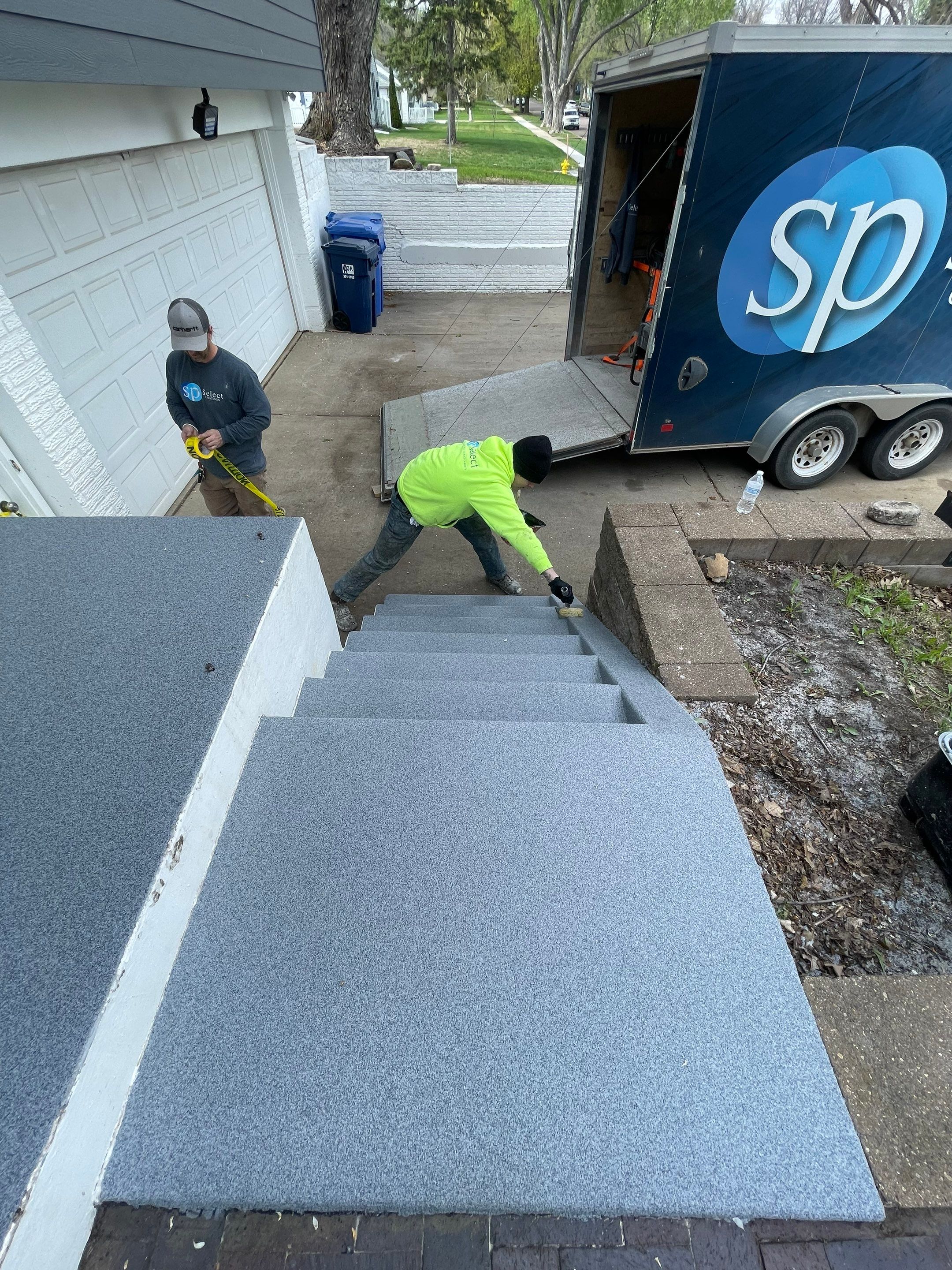 Grey Polyaspartic Porch and Stair Resurfacing in Sioux Falls by Select Painting, Coatings & Garage Cabinets