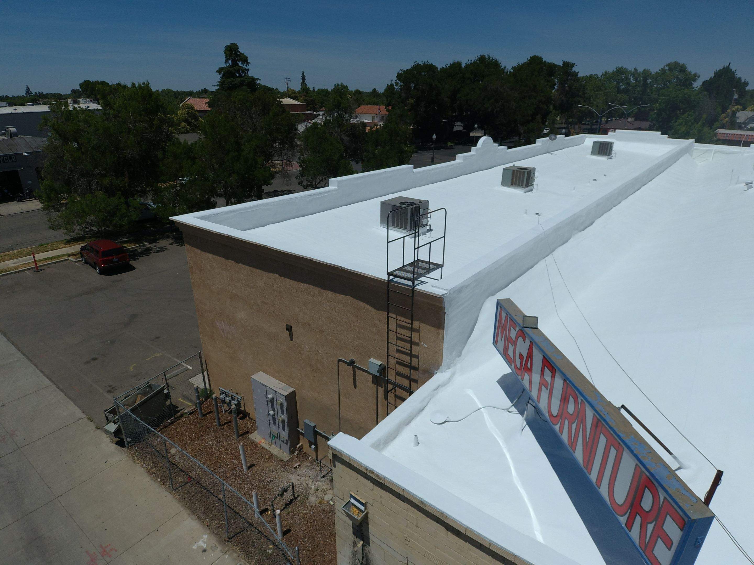 Spray foam and coatings using Conklin Benchmark/PUMA XL coatings and spray foam by Straight Edge Roofing Inc