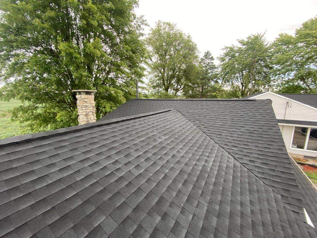 Storm damage roof replacement by Nitro Roofing and Construction