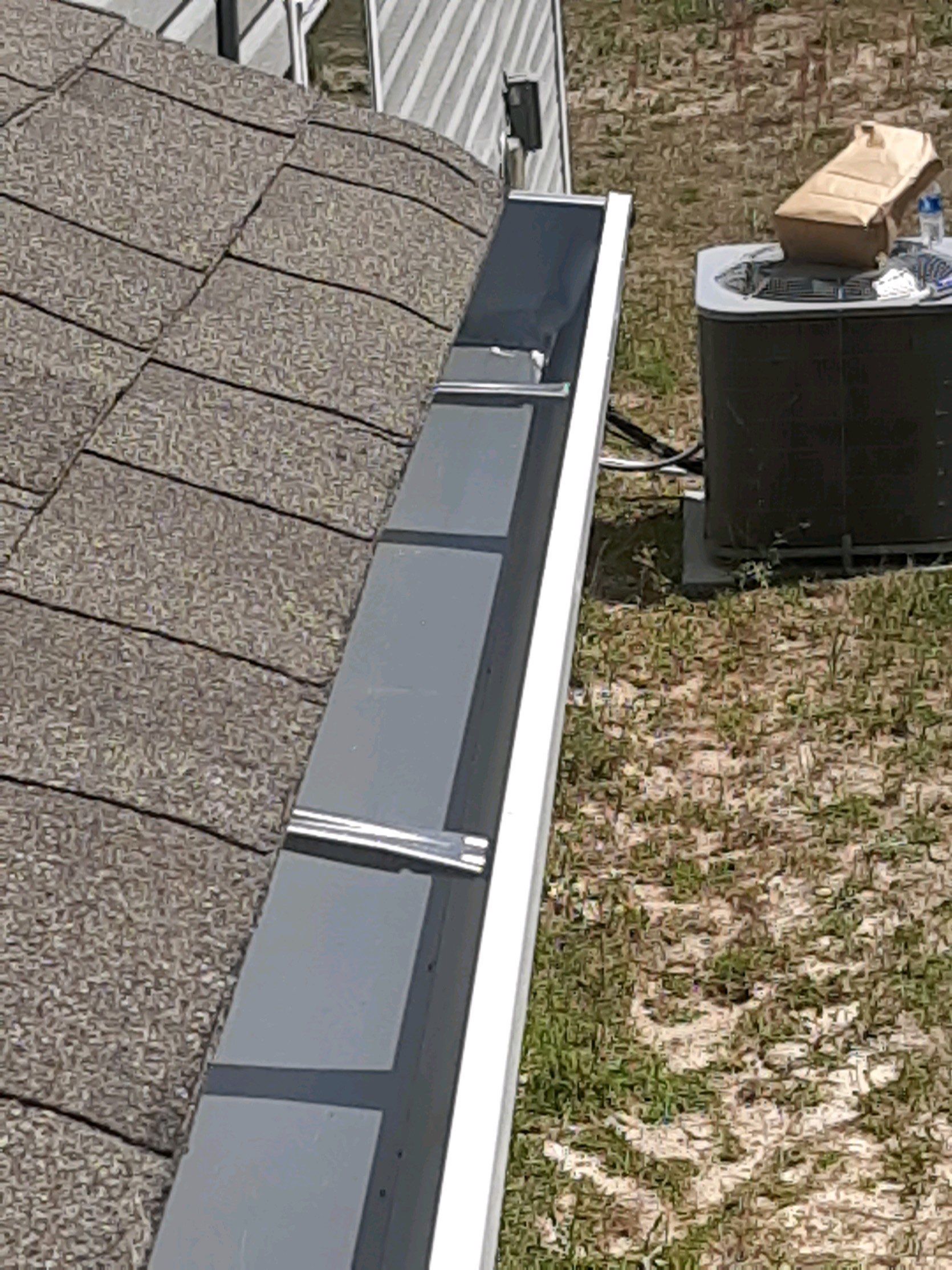 Gutter Installation Using White K-Style Seamless Gutters by Gutter Professors