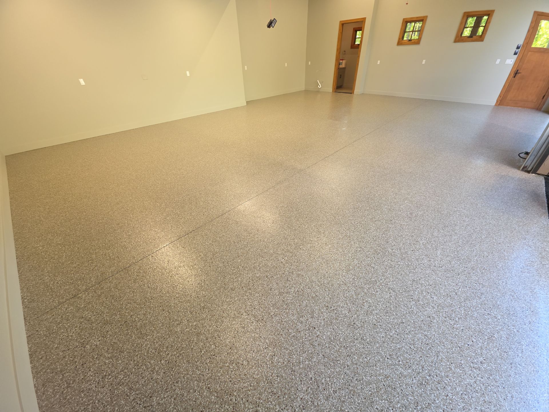 Garage Transformation using Pebble Beach by Croc Coatings, LLC