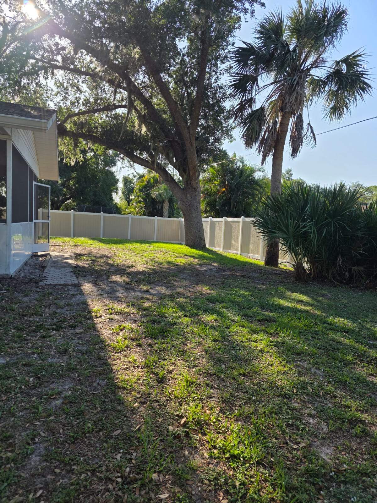 Two-Tone Vinyl Privacy Fence Installation in Port Charlotte by True Fence LLC