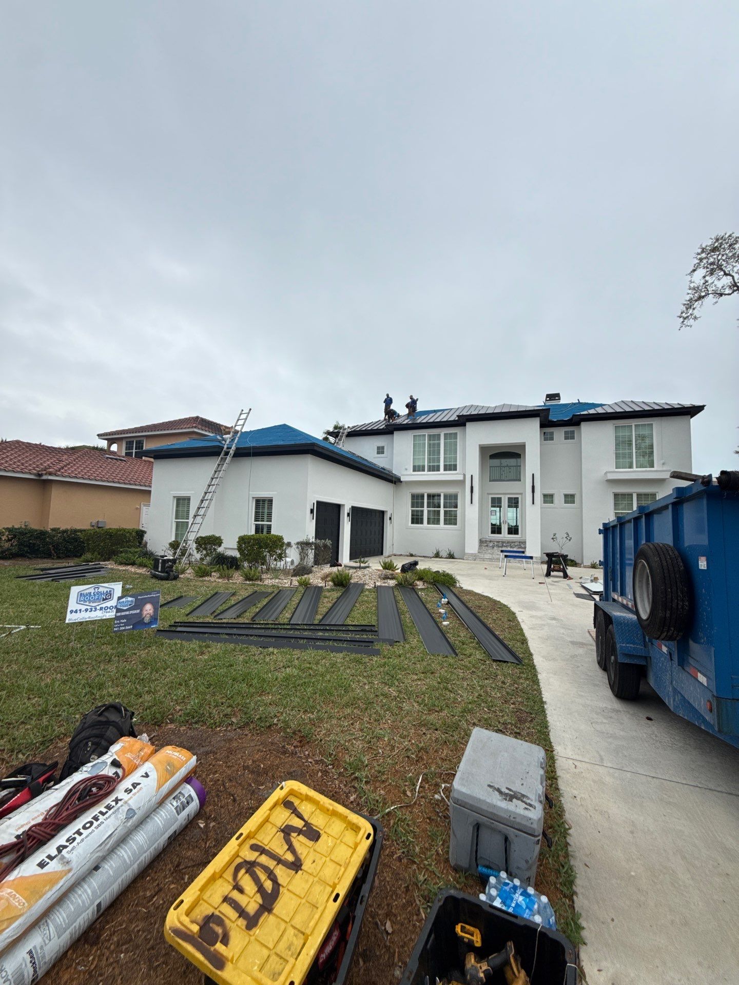 Soffit and Fascia Installation and black seamless gutters in Sarasota FL by Gutter Professors