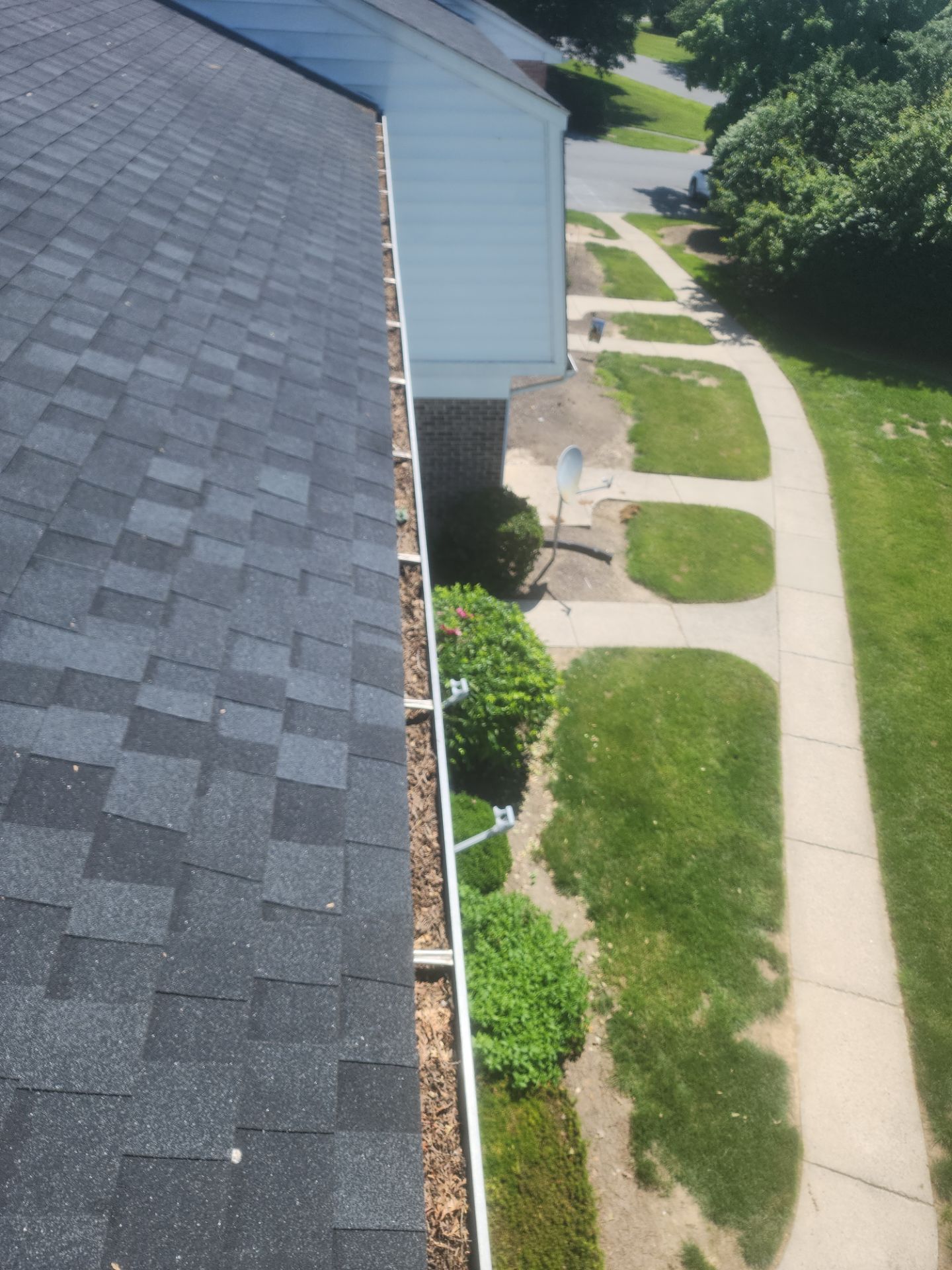Commercial gutter cleaning Lancaster, PA before photo with filled gutters