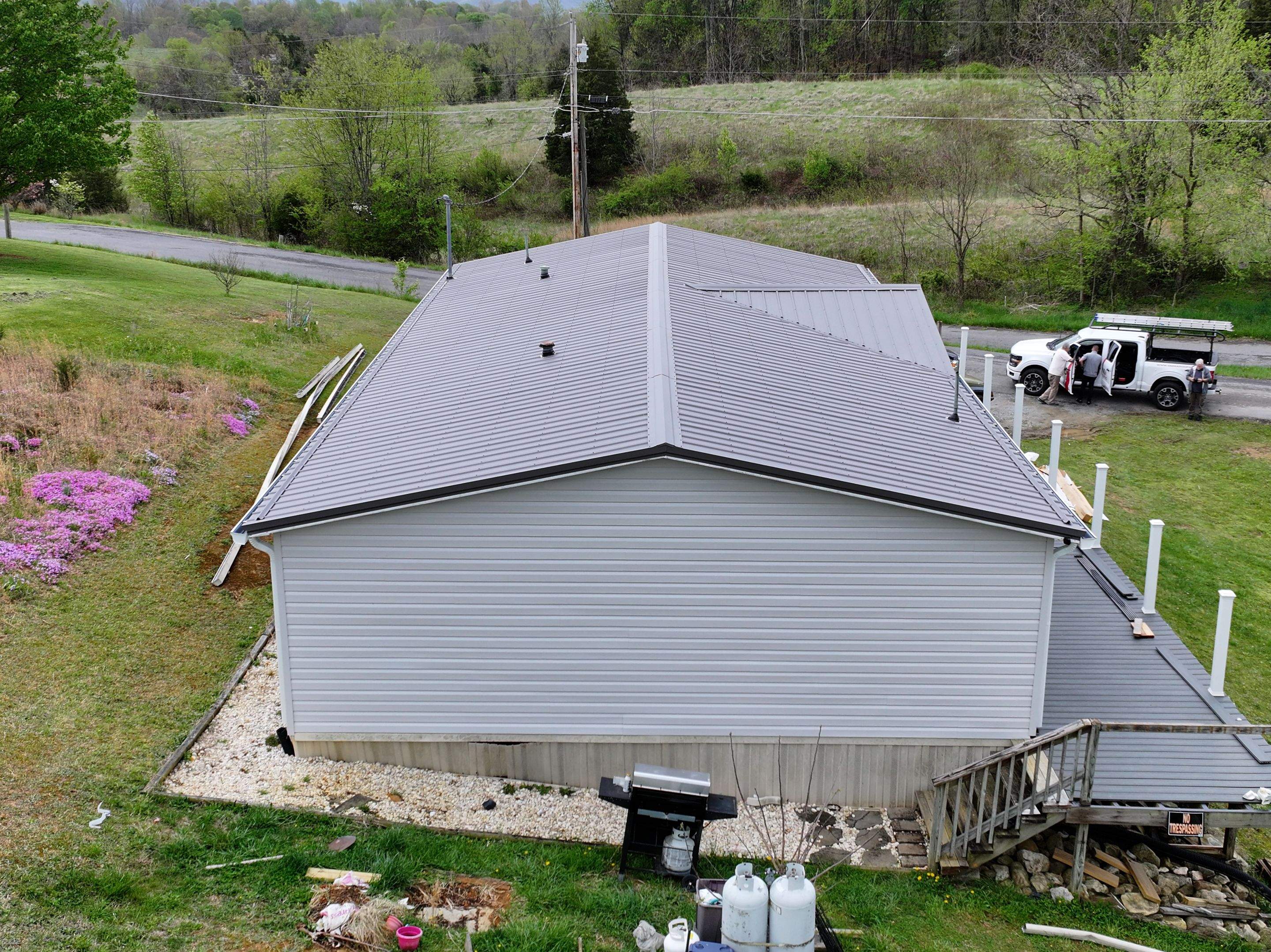 Charcoal Gray Textured Metal Roof by Omnia Roofing