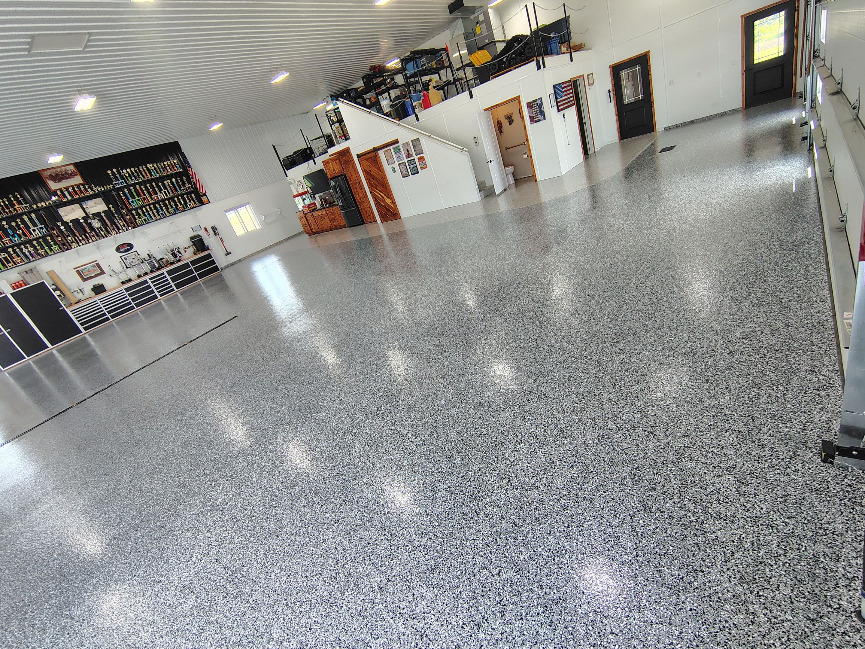 Multi-Stage Concrete Floor Coating for Egan Shop and RV Storage by Select Painting, Coatings & Garage Cabinets