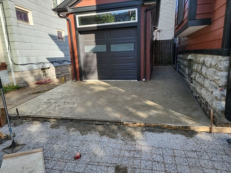 Exterior Renovations- Siding, Stamped Concrete, Porch, and Railings by Ivy Lea Construction