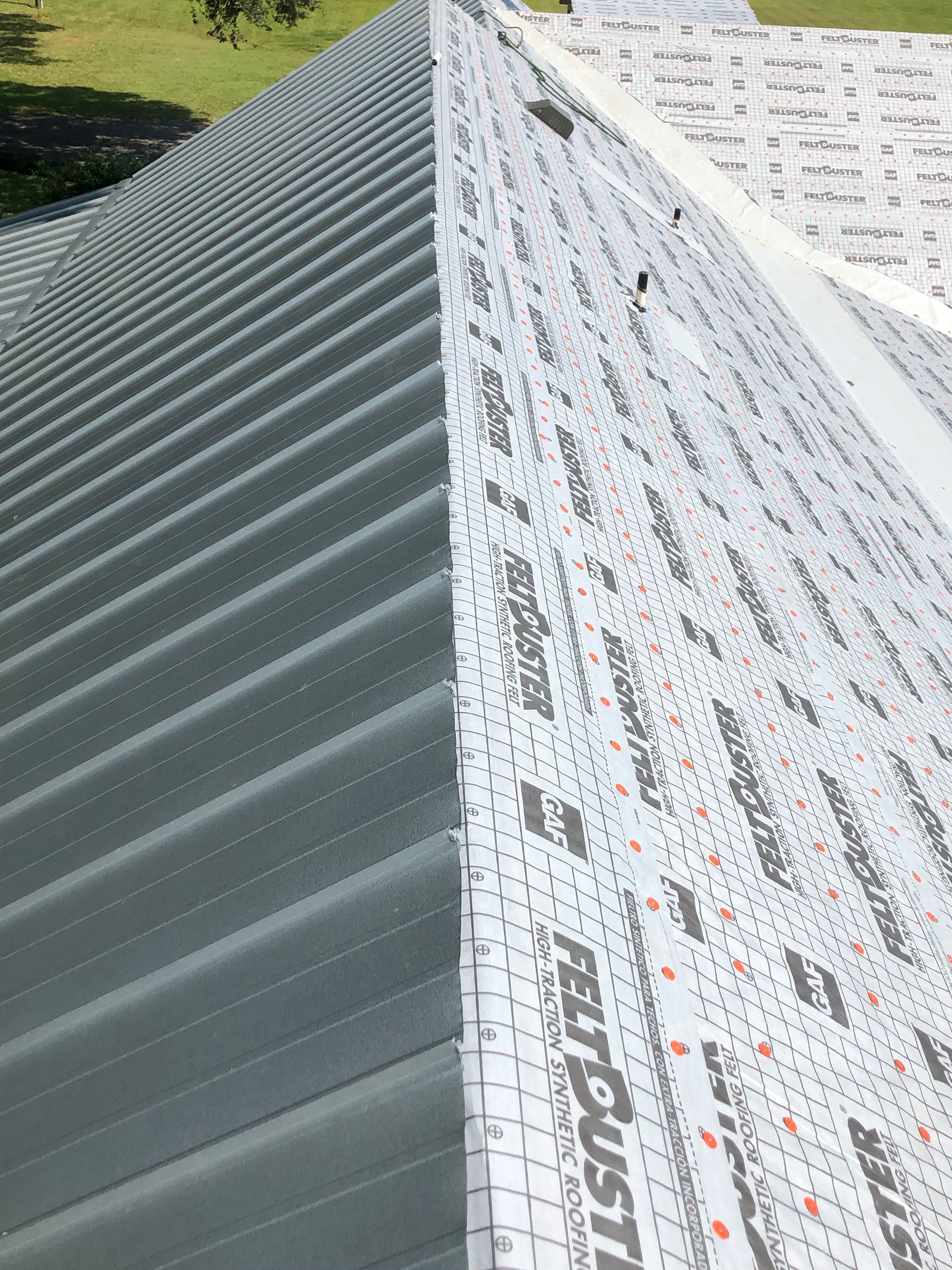 Residential Roofing Installation using Metal roofing by American Roofing & Construction LLC