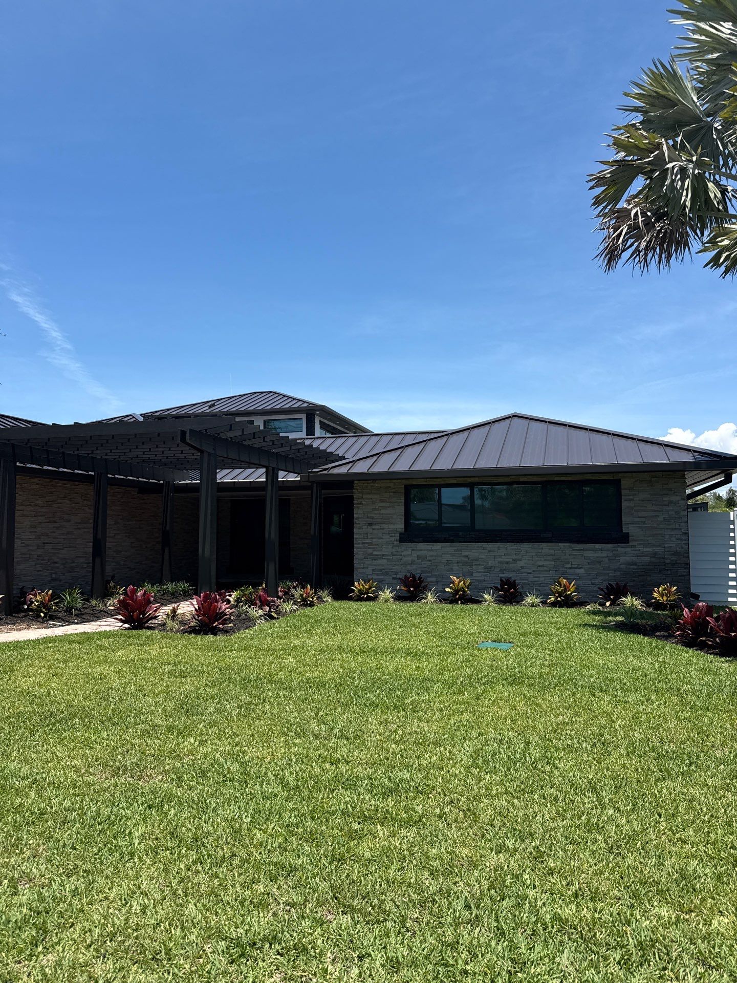 7-Inch Smooth Box Seamless Gutters using black seamless gutters in Siesta Key Fl by Gutter Professors