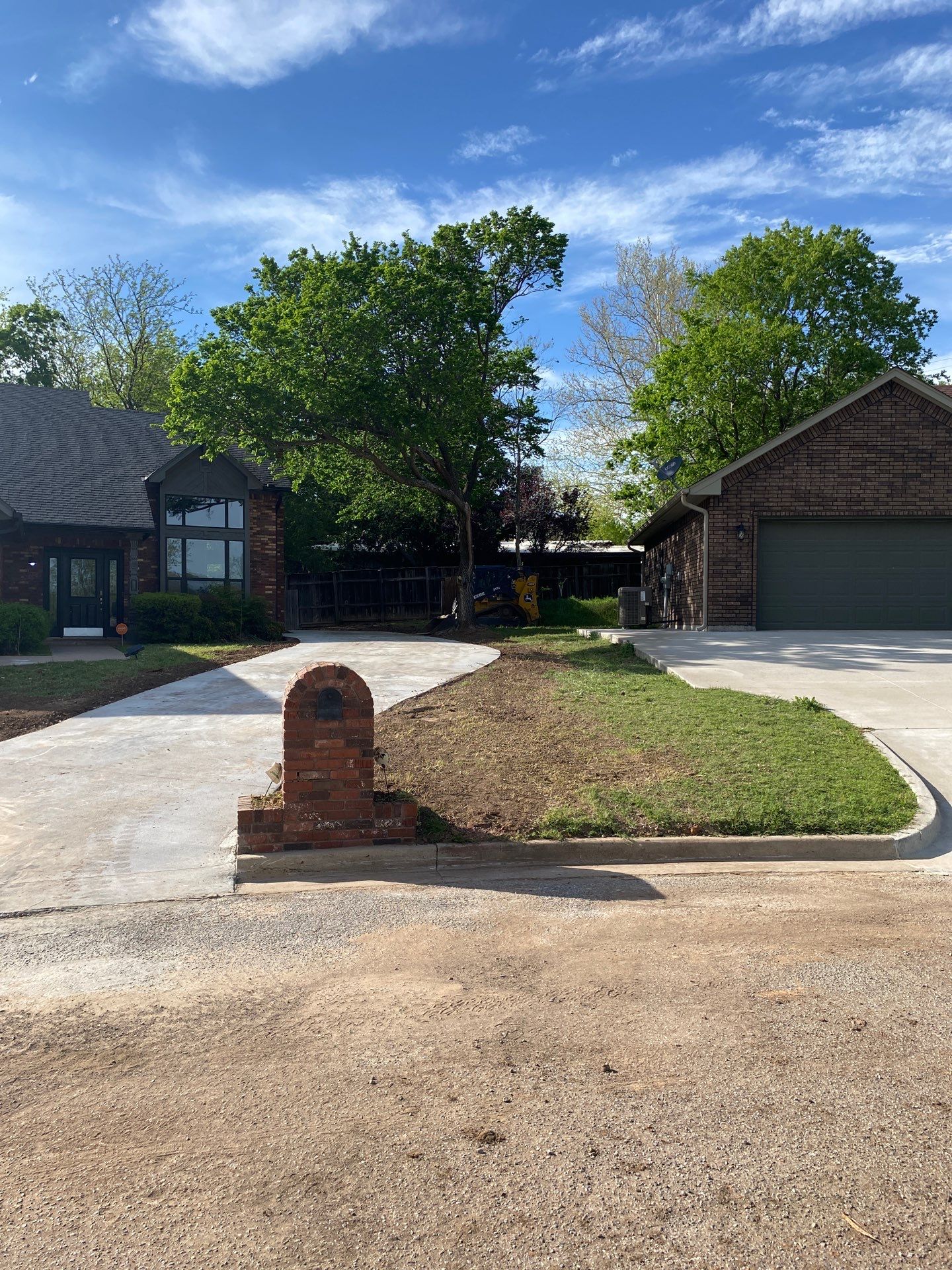 Concrete Driveway and Fence by Clays Services Inc