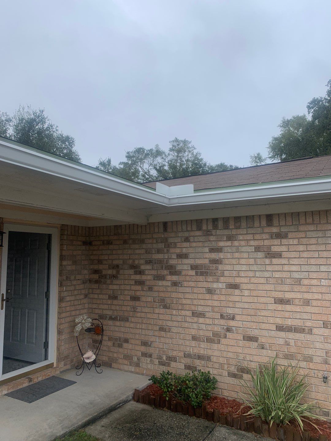 White Seamless Gutter Installation in Milton FL