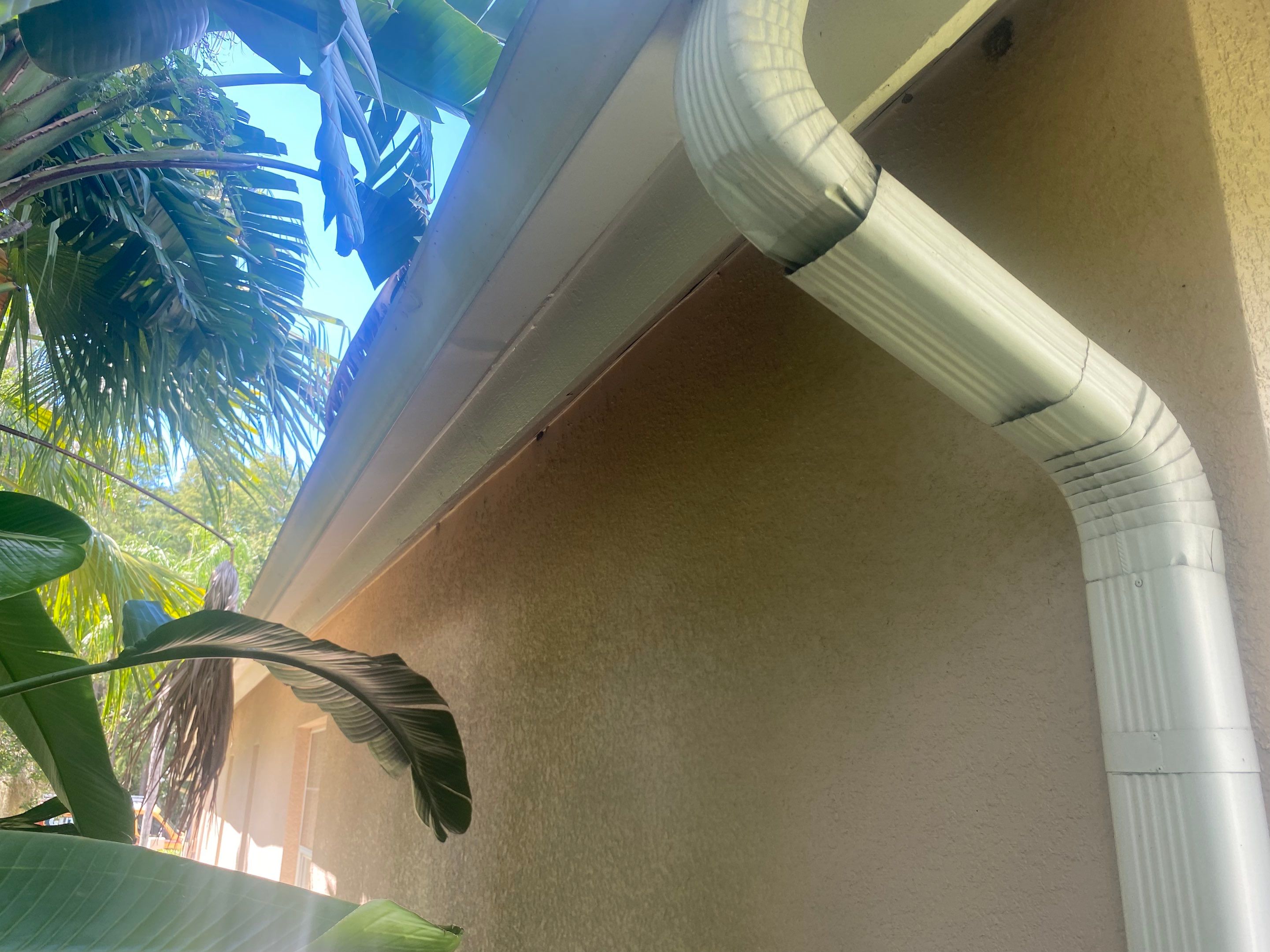 White Gutters and White Downspouts by Gutter Professors