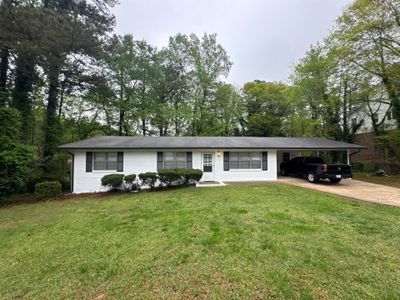 White Brick Exterior Painting and Shutter Refresh in Marietta