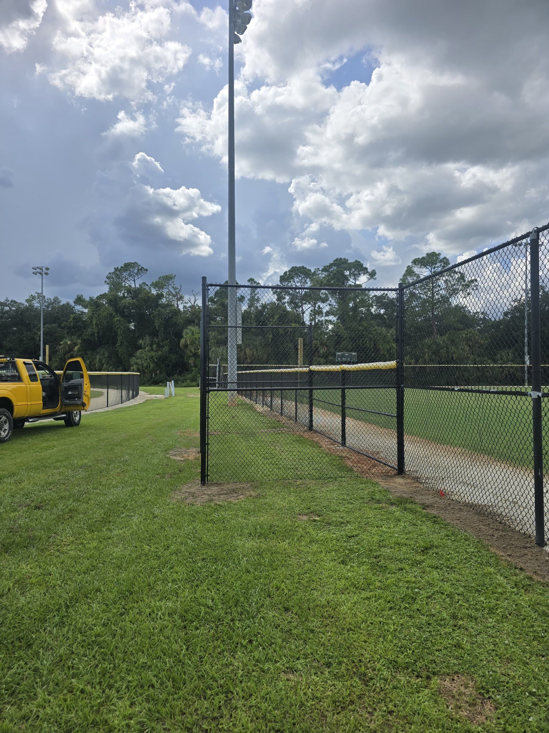 Commercial Black Chain Link Fence Installation in North Port by True Fence LLC